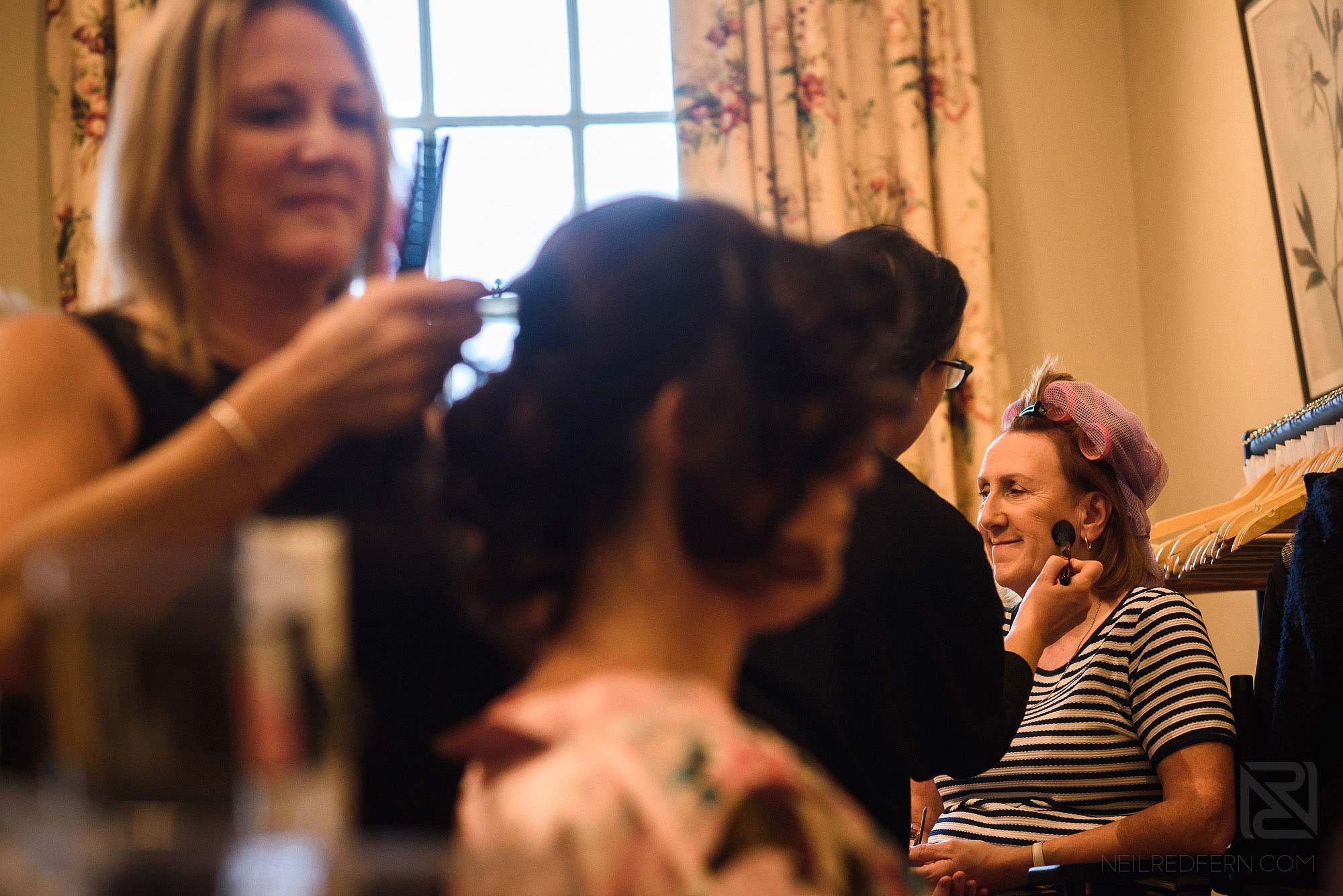 mother of bride having make-up applied