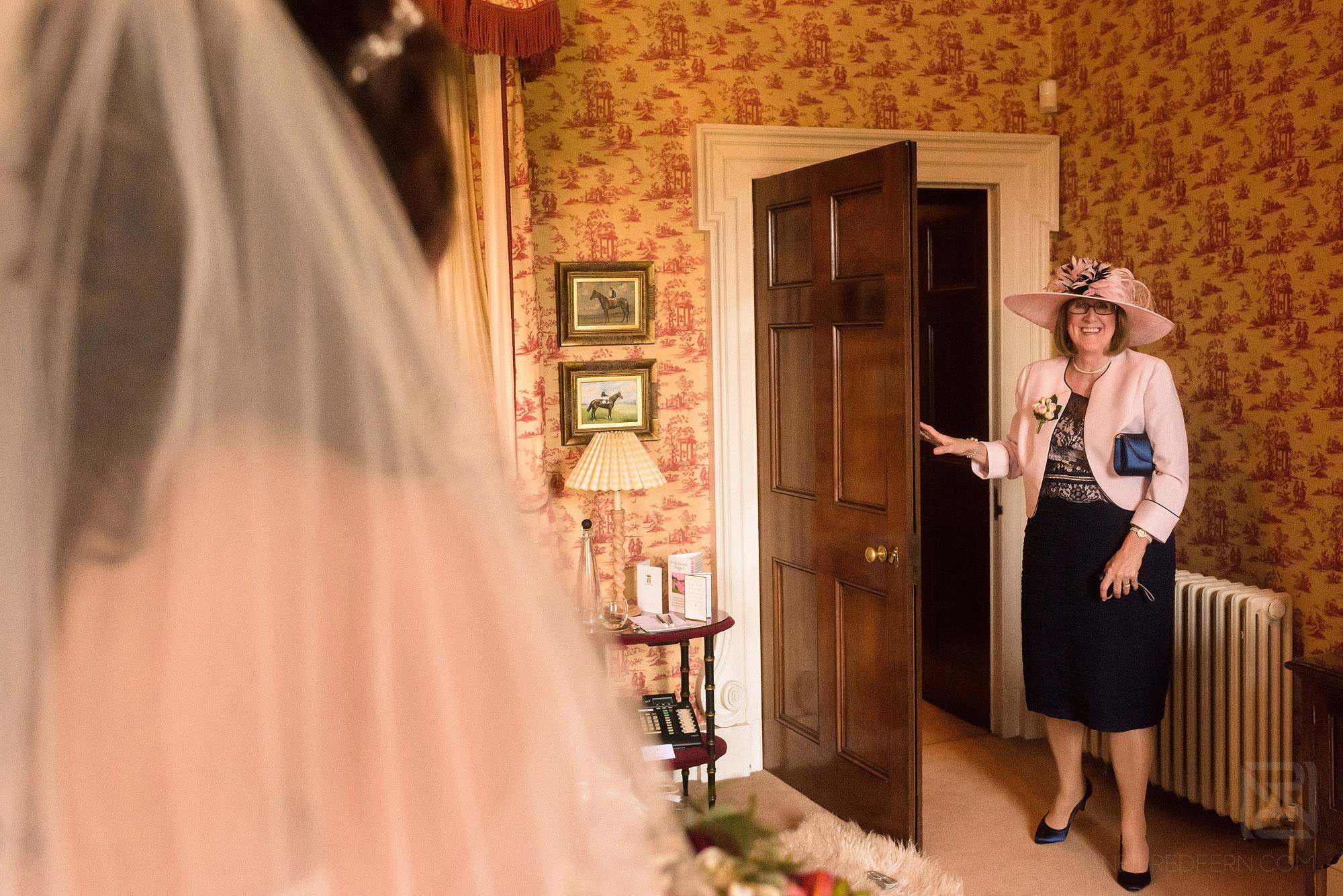 mother of bride seeing bride in wedding dress