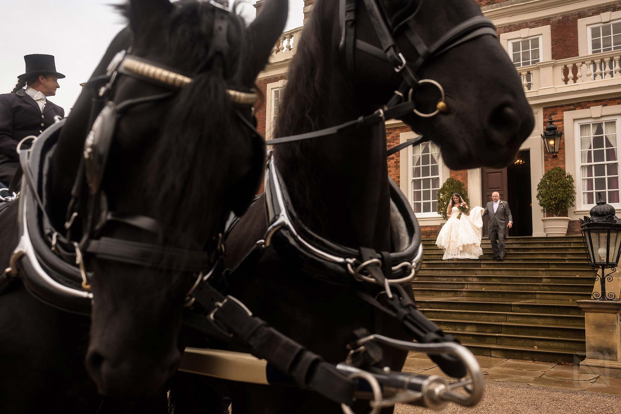 bride and father leaving Knowsley Hall