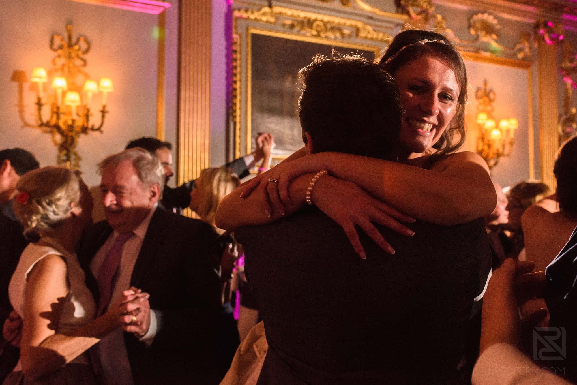 bride and groom hugging on dancefloor