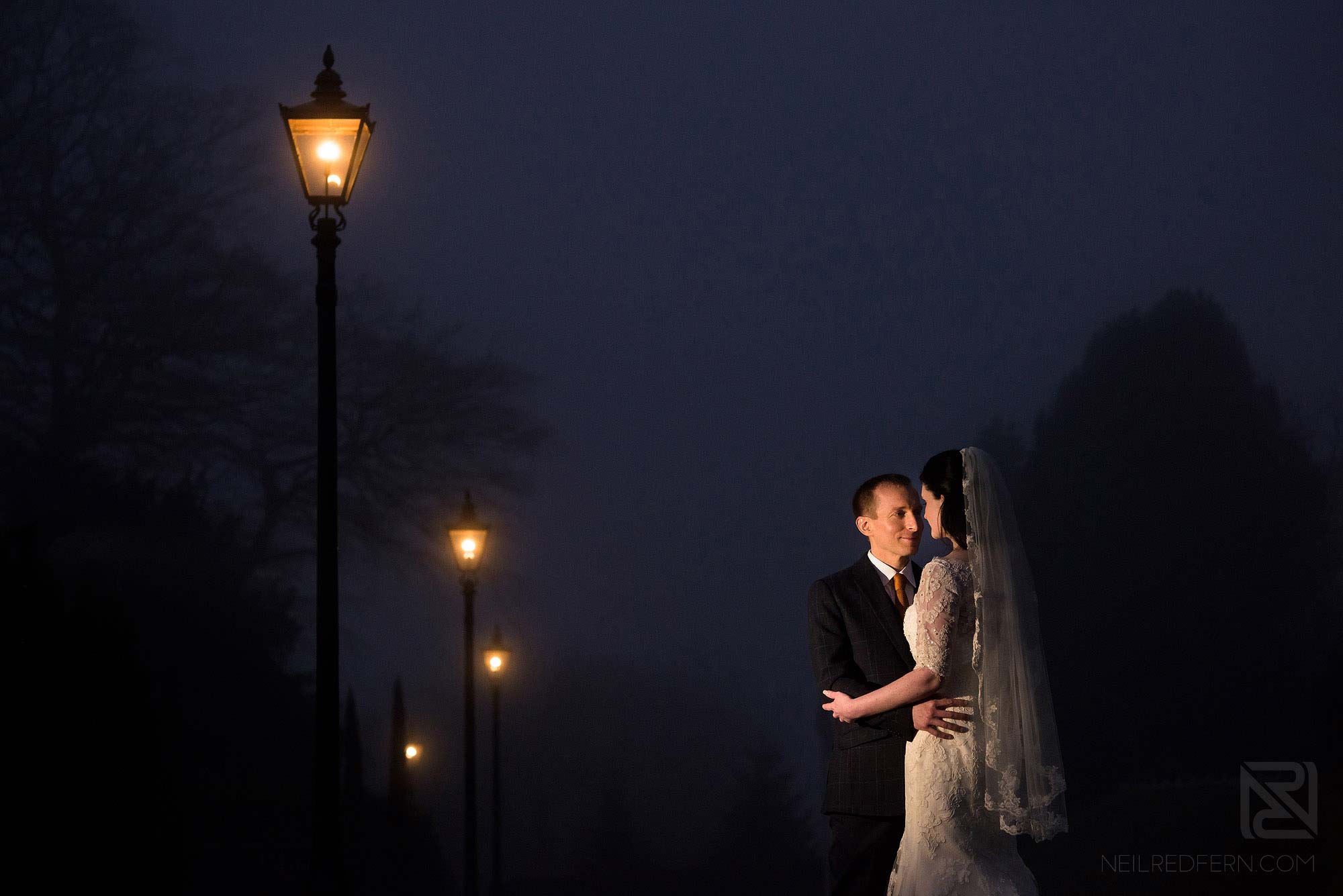 evening photograph of bride and groom outside Broadoaks Country House in Lake District