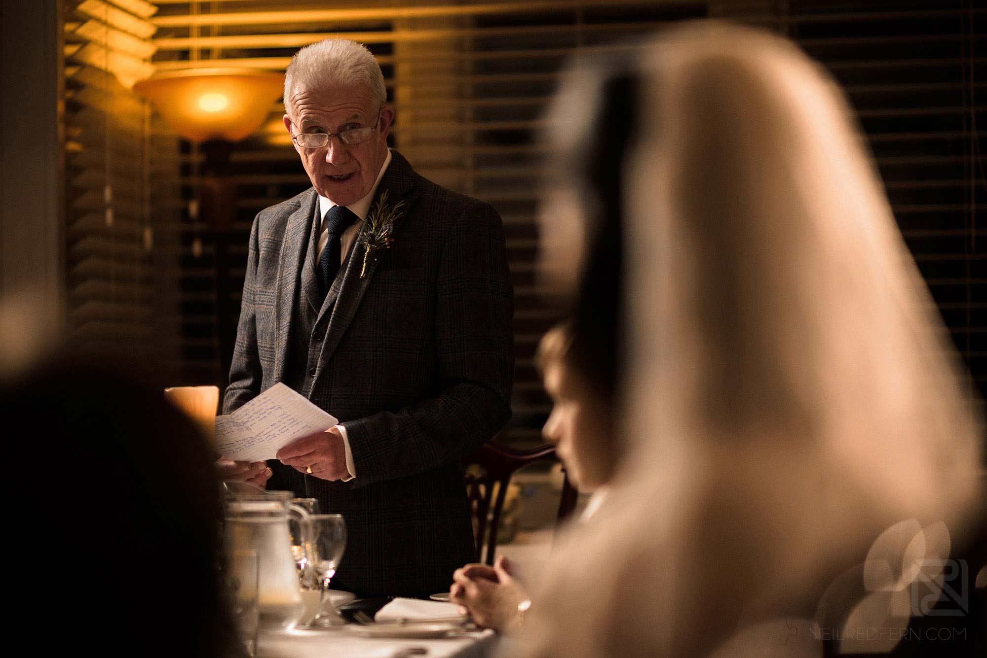 father of bride making wedding speech at winter wedding