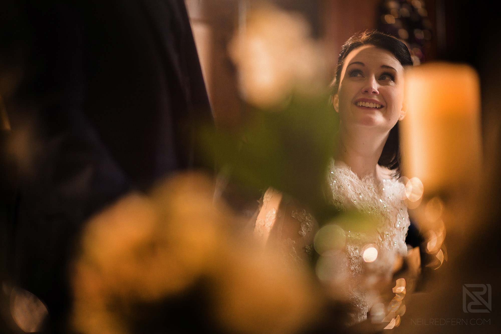 bride looking up at groom during wedding speech