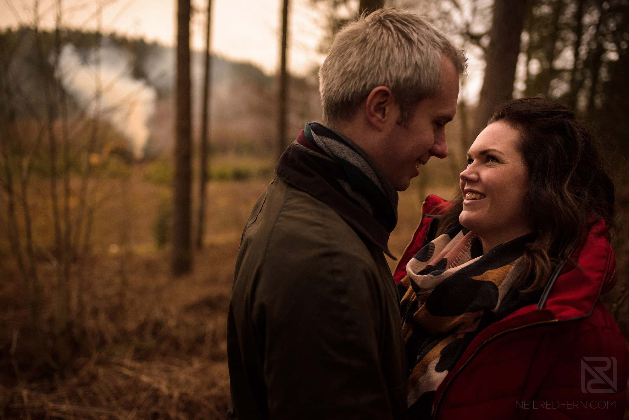 Woodland engagement shoot 2 couple smiling in the forest