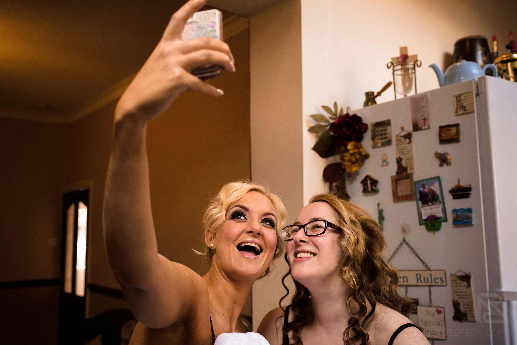 Manchester Museum wedding photography 6 bride and bridesmaid taking selfie photograph