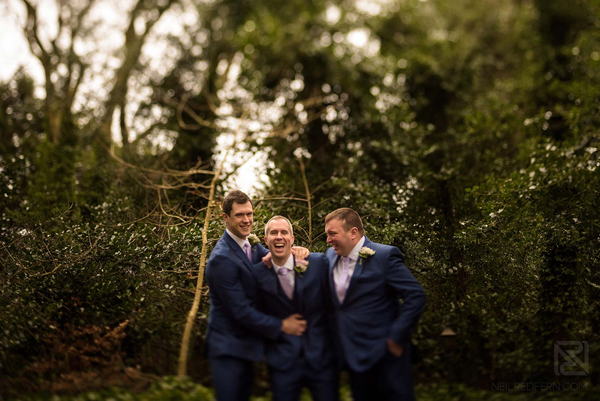groom and best men laughing before wedding at Rowton Hall