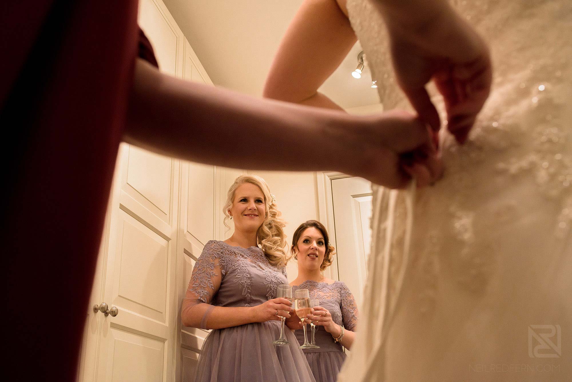 doing up the back of wedding dress