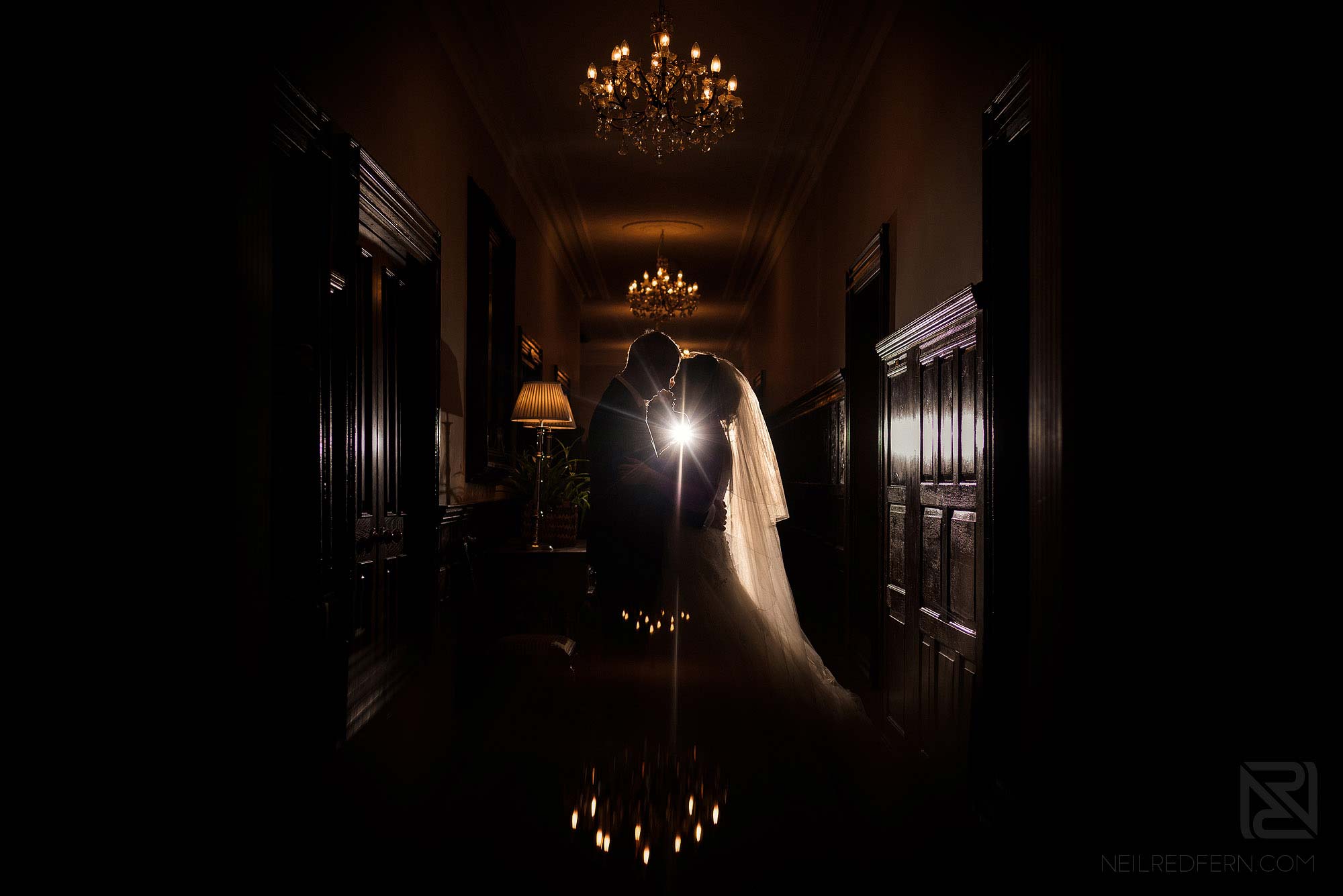 creative indoor photograph of bride and groom at Rowton Hall in Cheshire