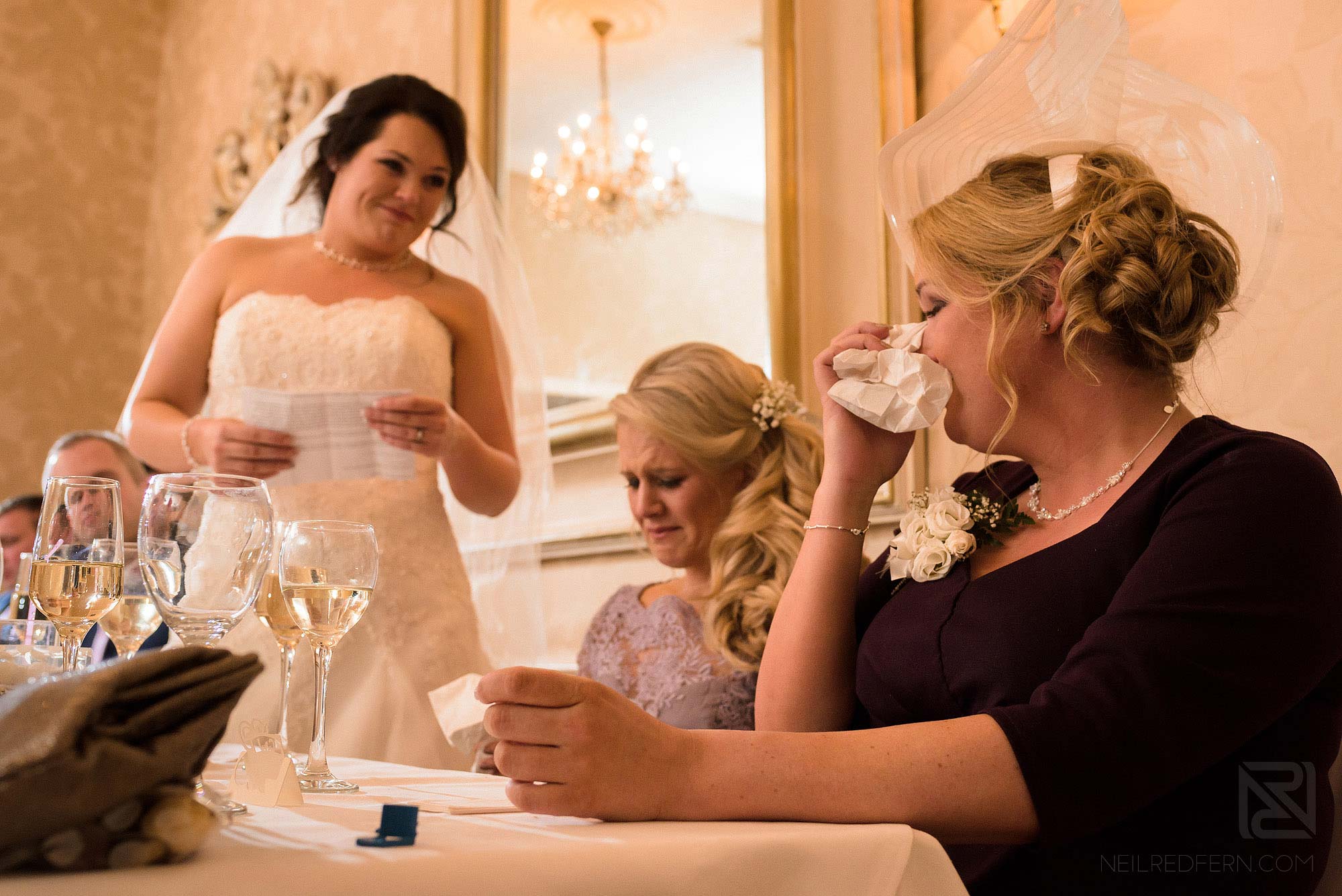 top table getting emotional during wedding speeches at Rowton Hall