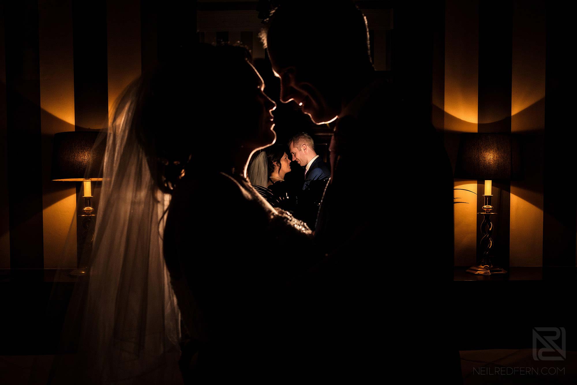 creative flash portrait of bride and groom indoors at Rowton Hall
