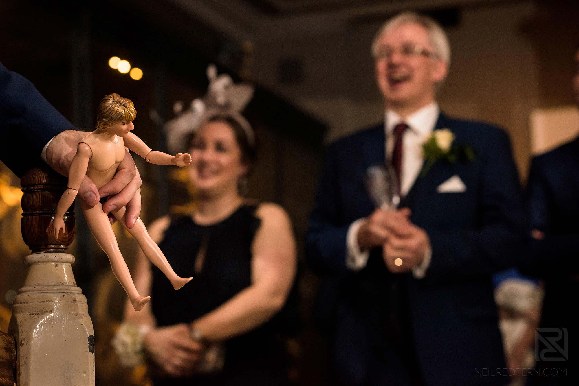 Manchester Museum wedding photography 28 groom holding doll during best man's speech