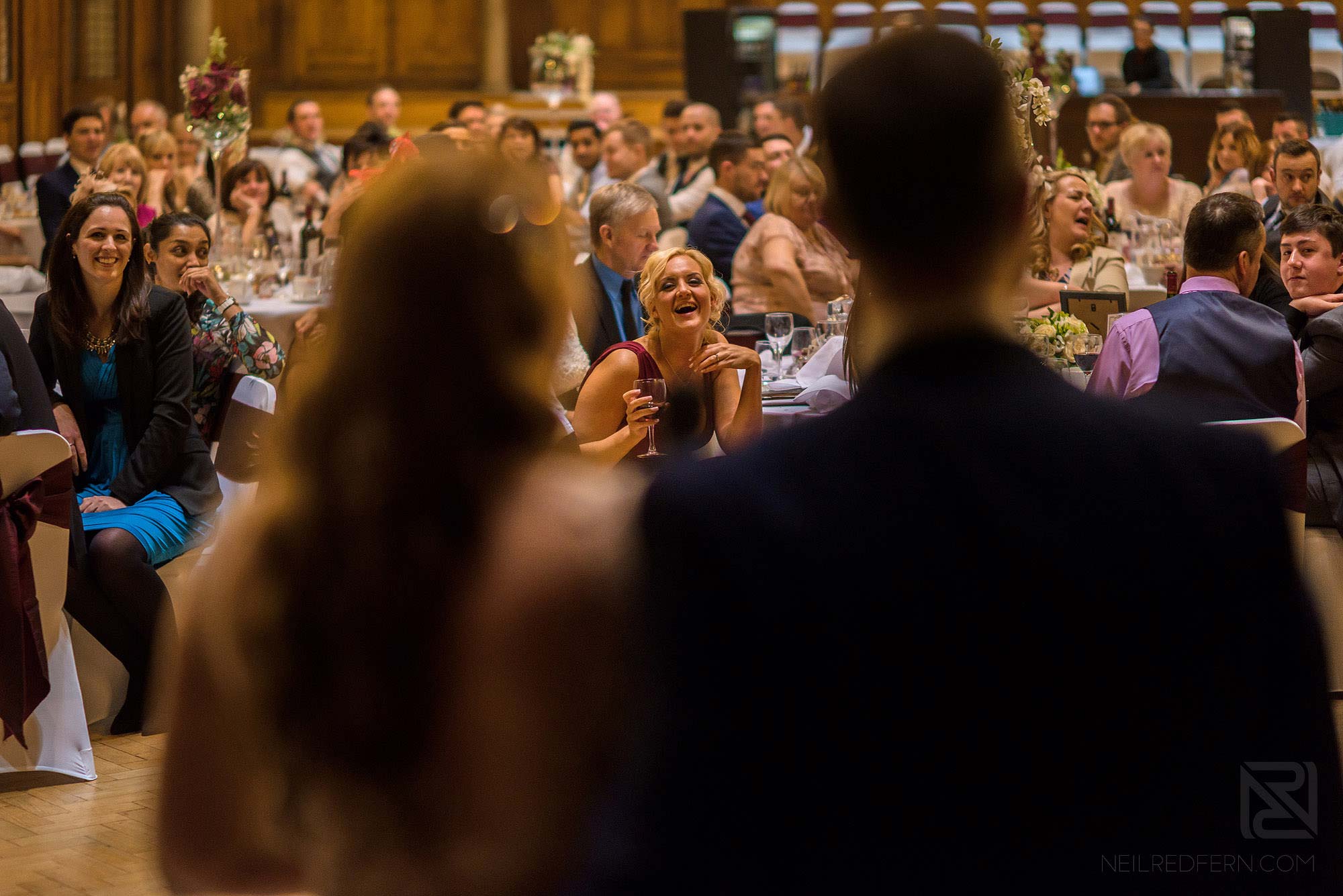Manchester Museum wedding photography 29 bride and groom giving speech in Whitworth Hall in Manchester