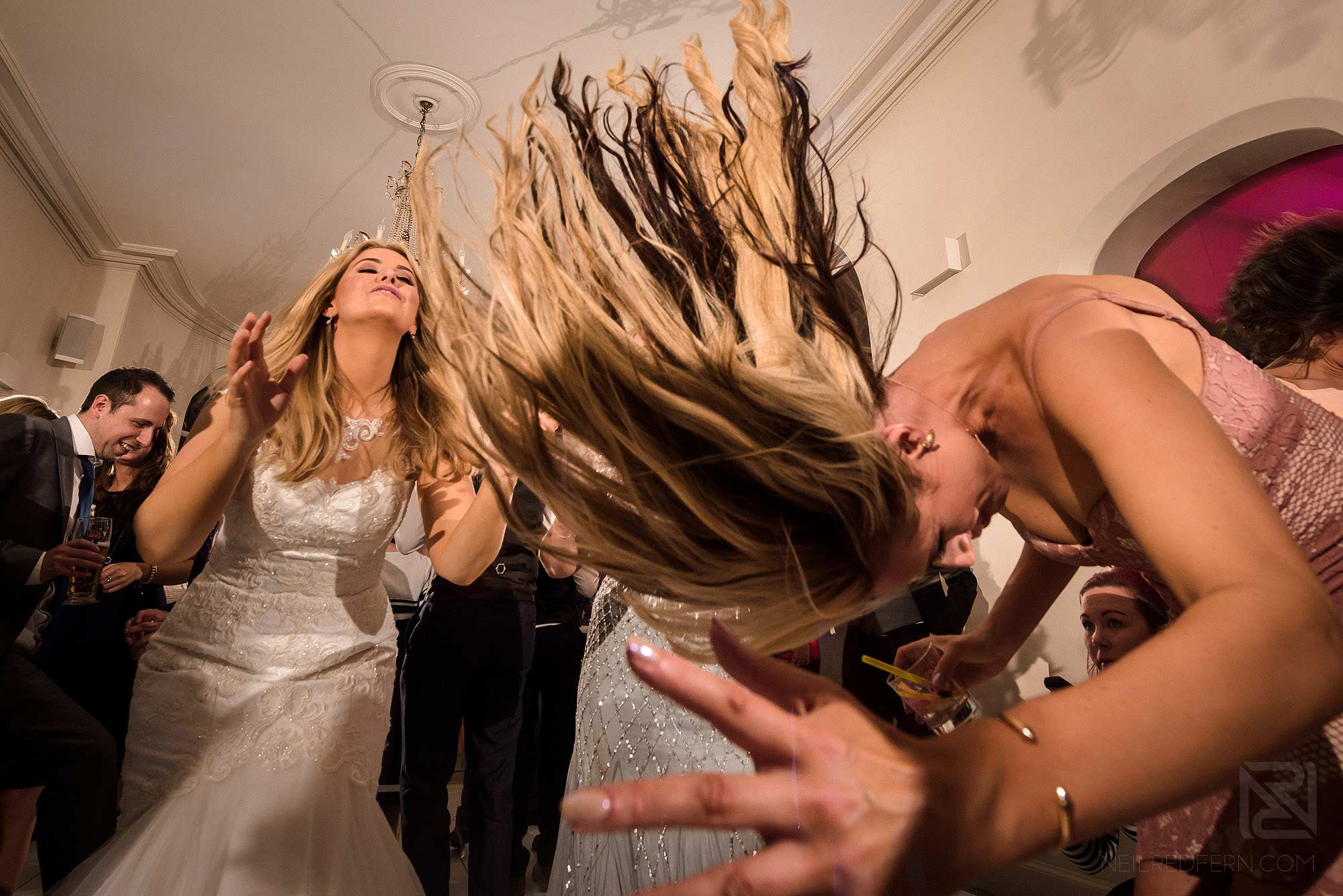 wedding guest throwing hair back at Iscoyd Park wedding