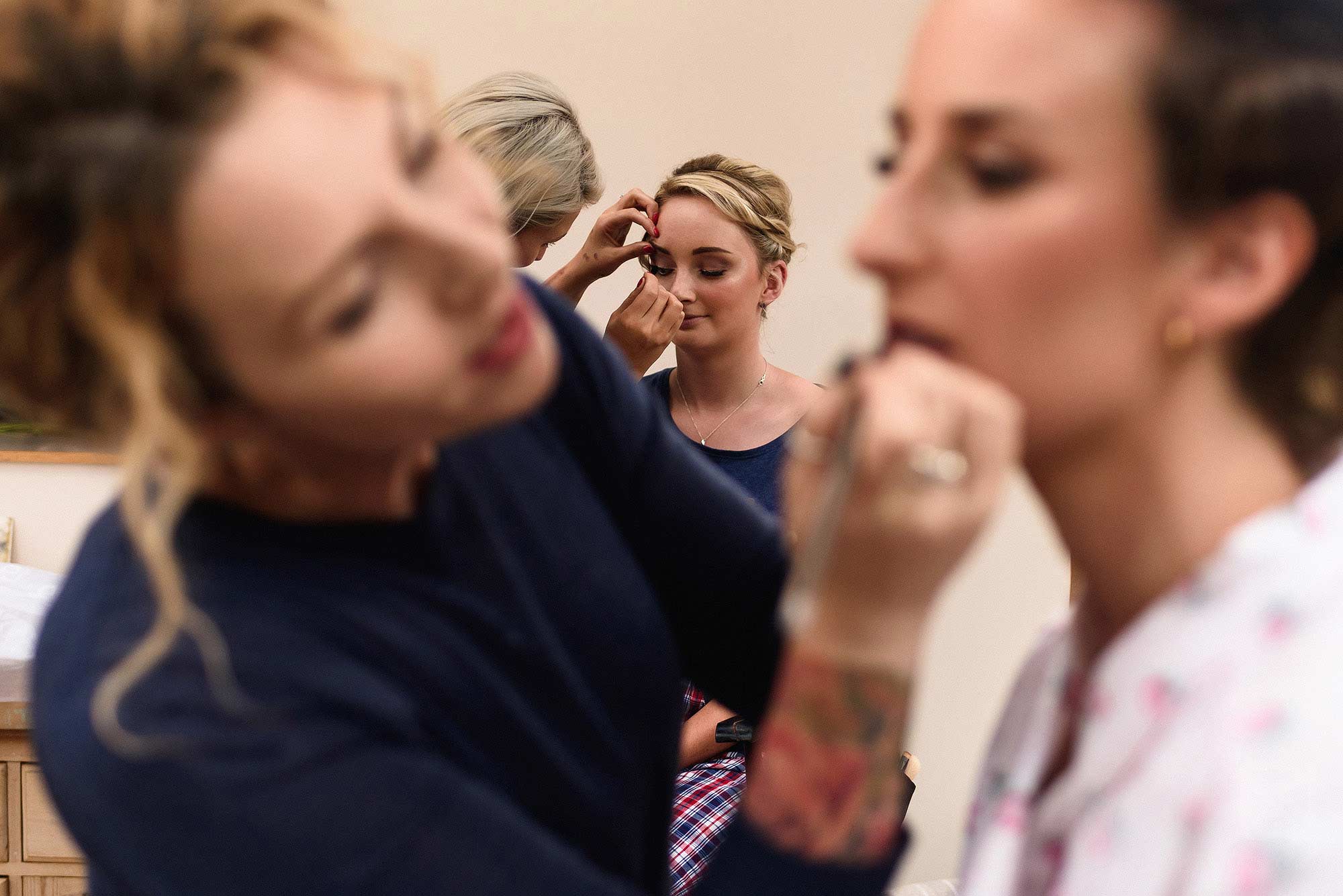 bride having make up put on