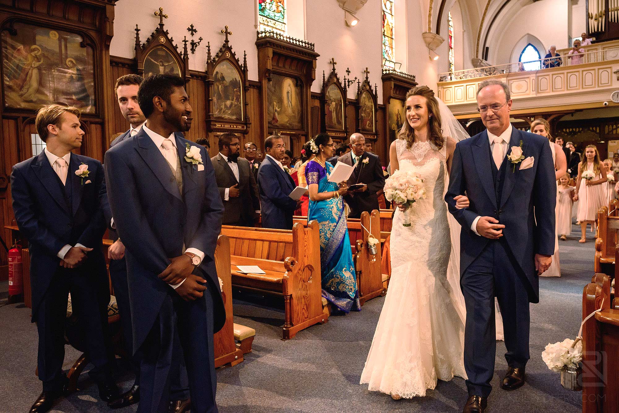 bride walking down the aisle with father