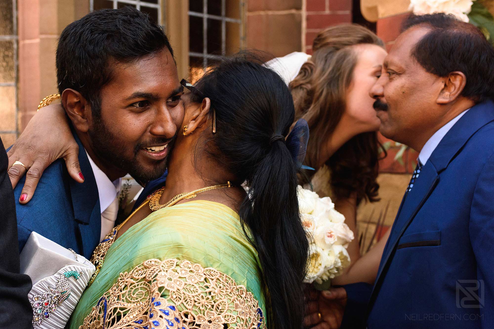guests congratulating bride and groom
