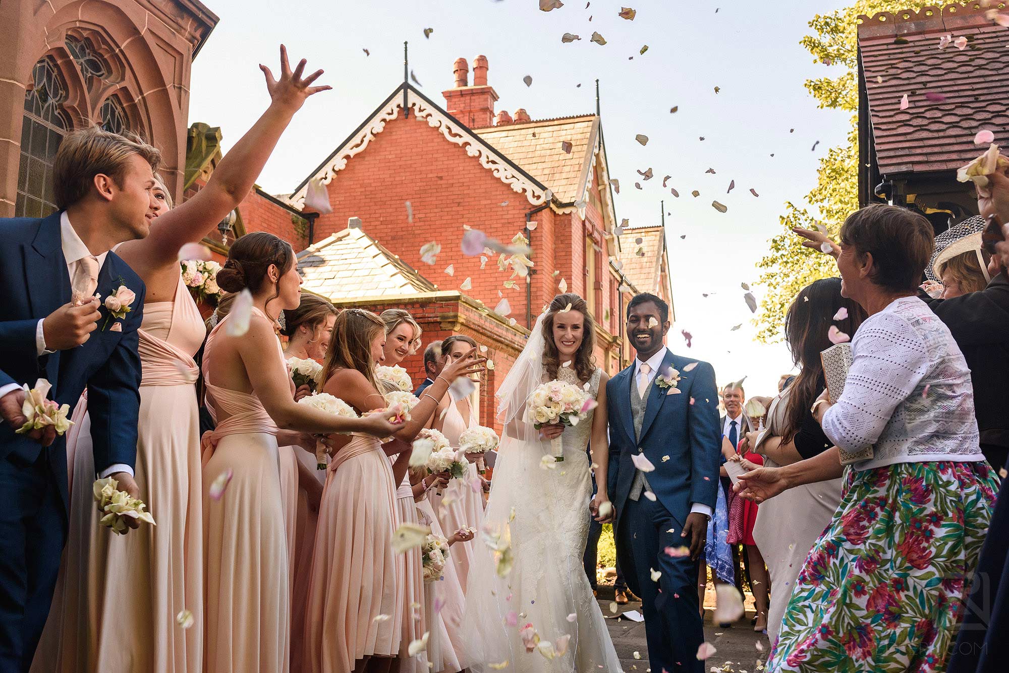 wedding guests throwing confetti