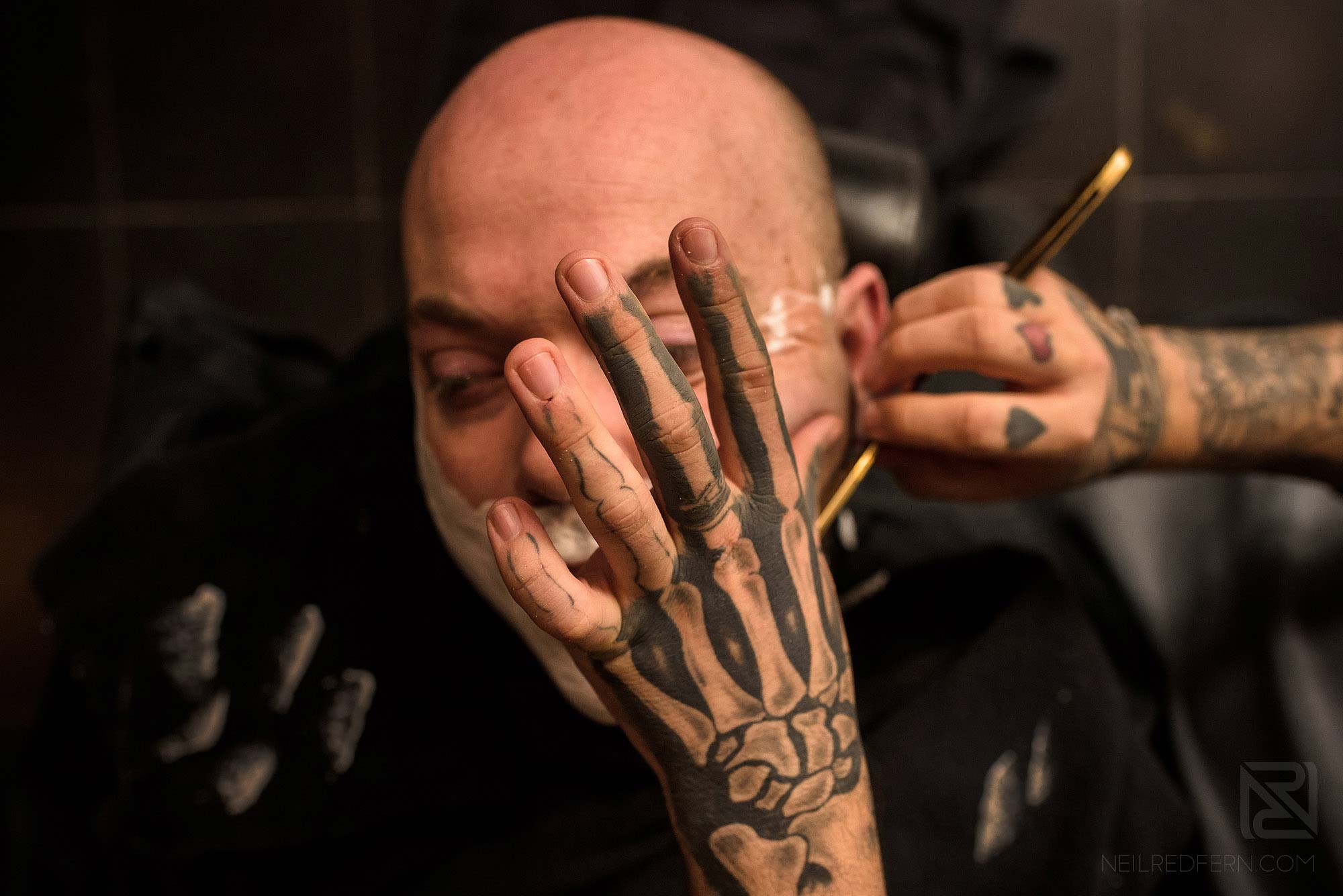 groom having shave on morning of wedding