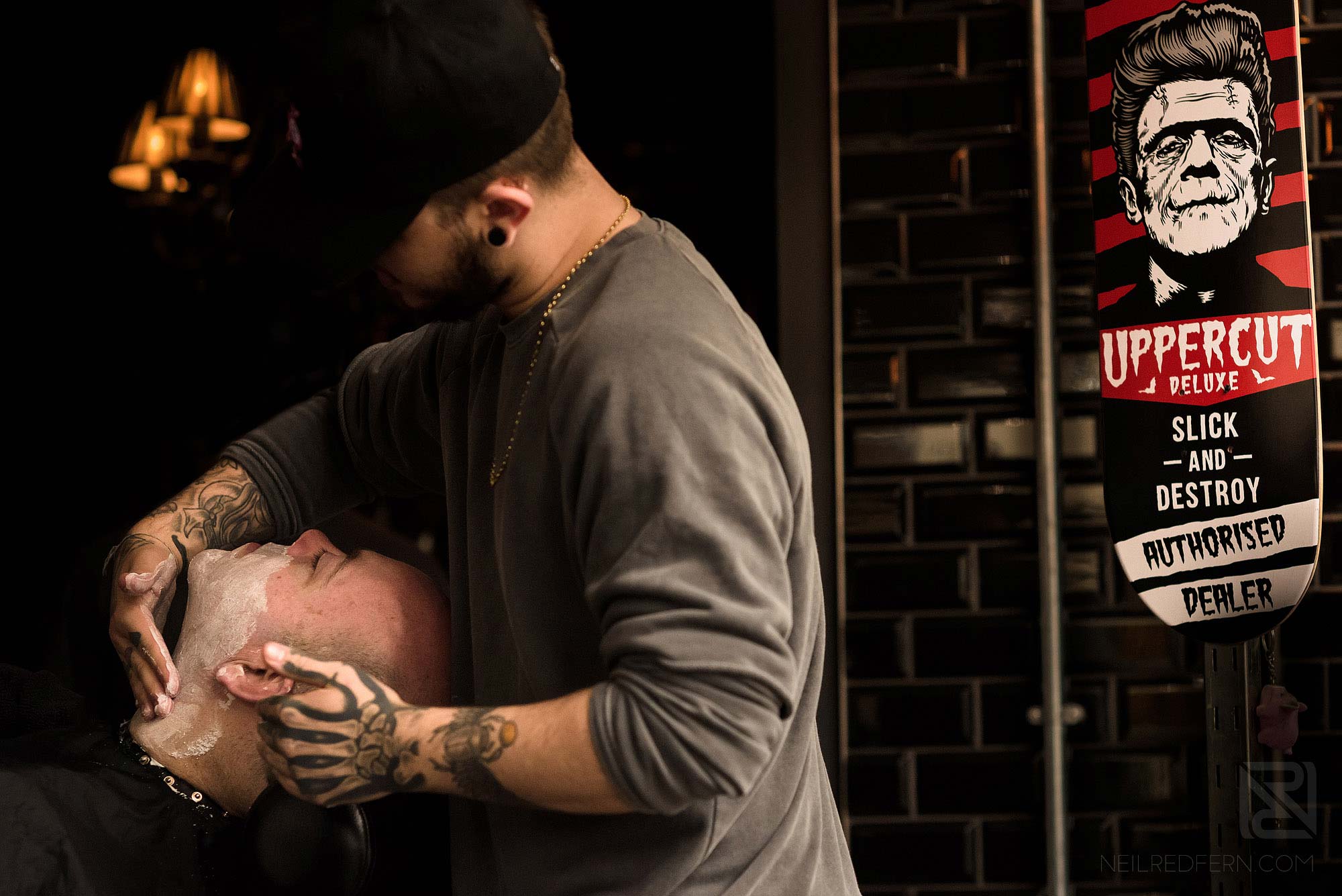 groom being shaved on the morning of his wedding