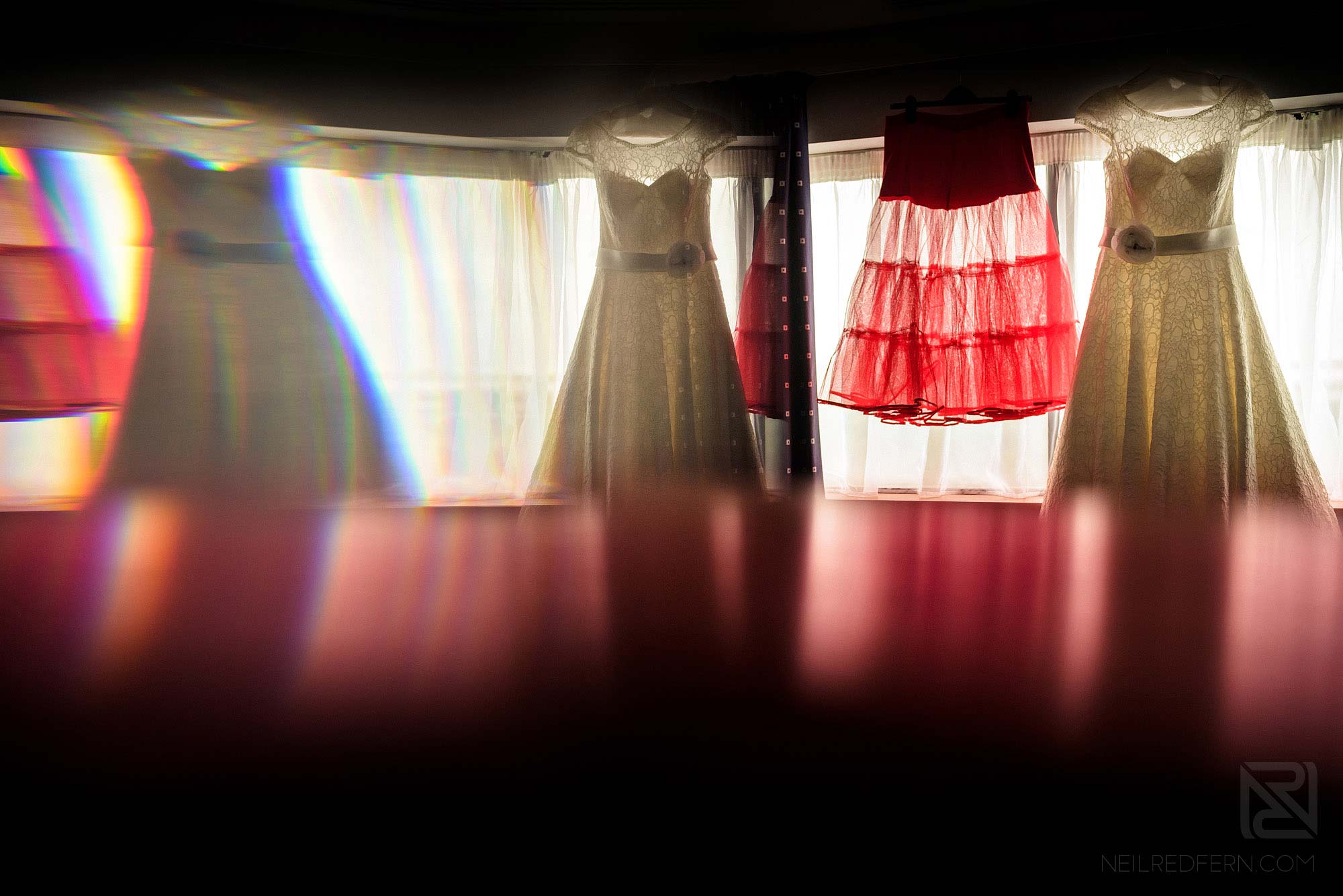 creative photograph of wedding dress using a prism