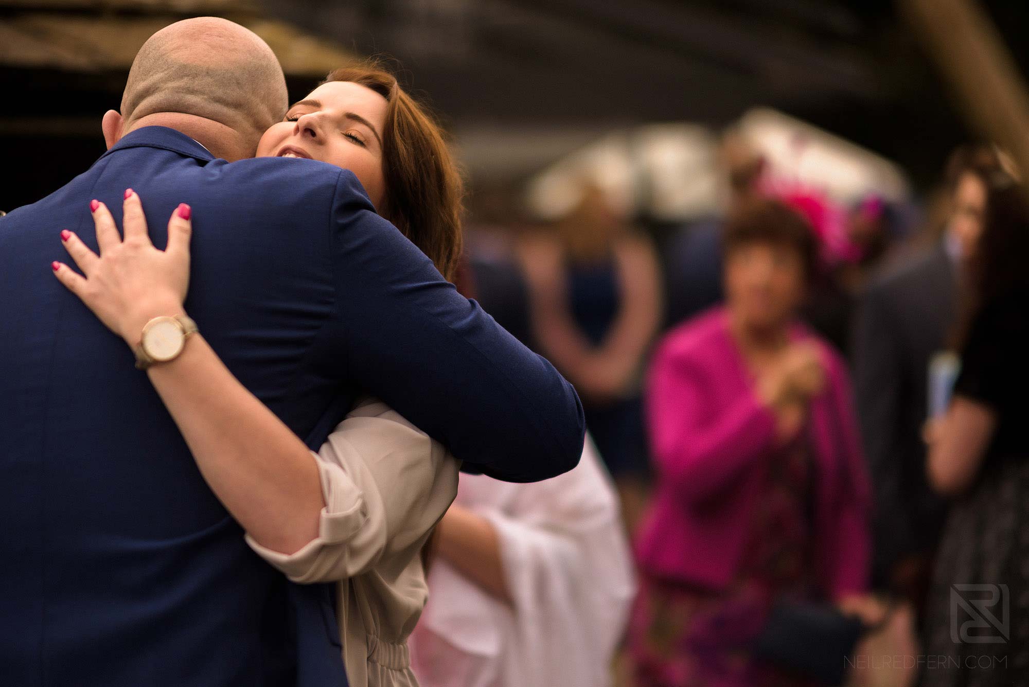 guest greeting groom outside Rivington Hall Barn
