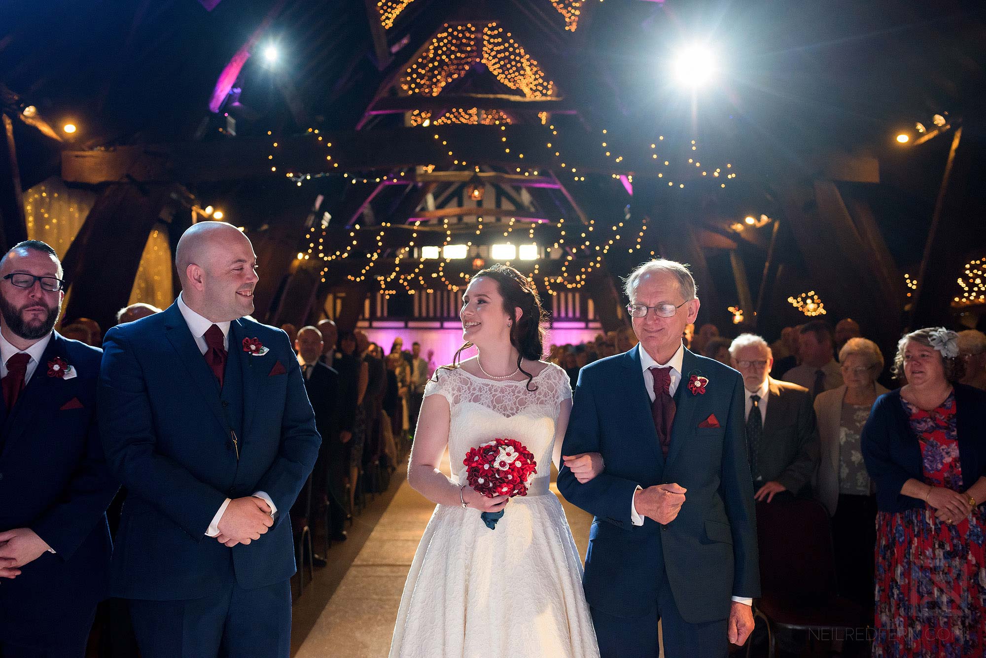 bride walking down the aisle with father