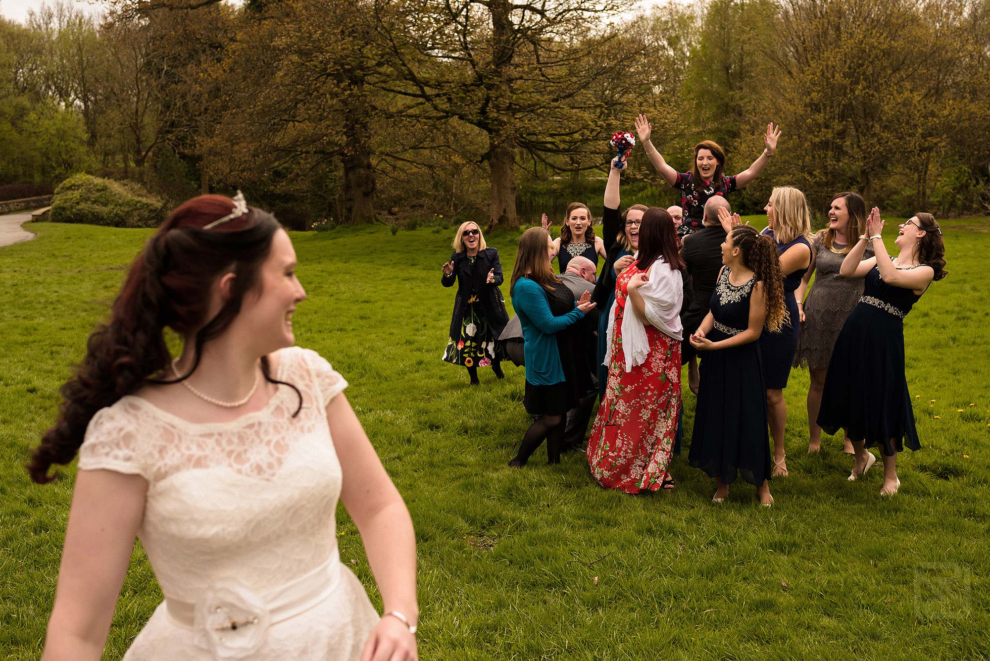 bride throwing bouquet