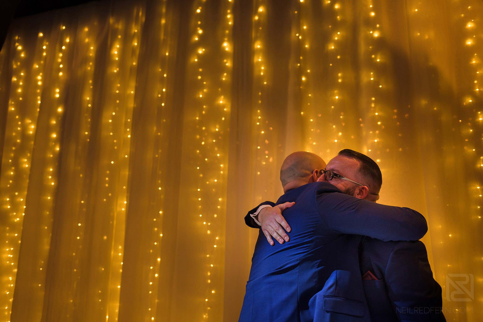 groom and Best Man hugging after speeches