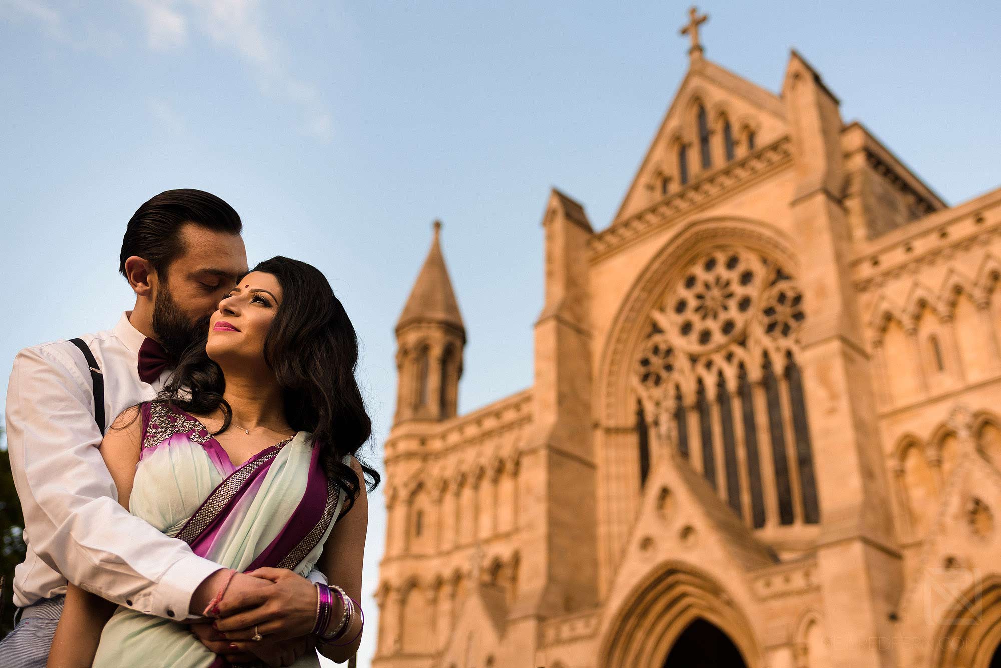 Hindu bride and groom outside St Albans Cathedral 