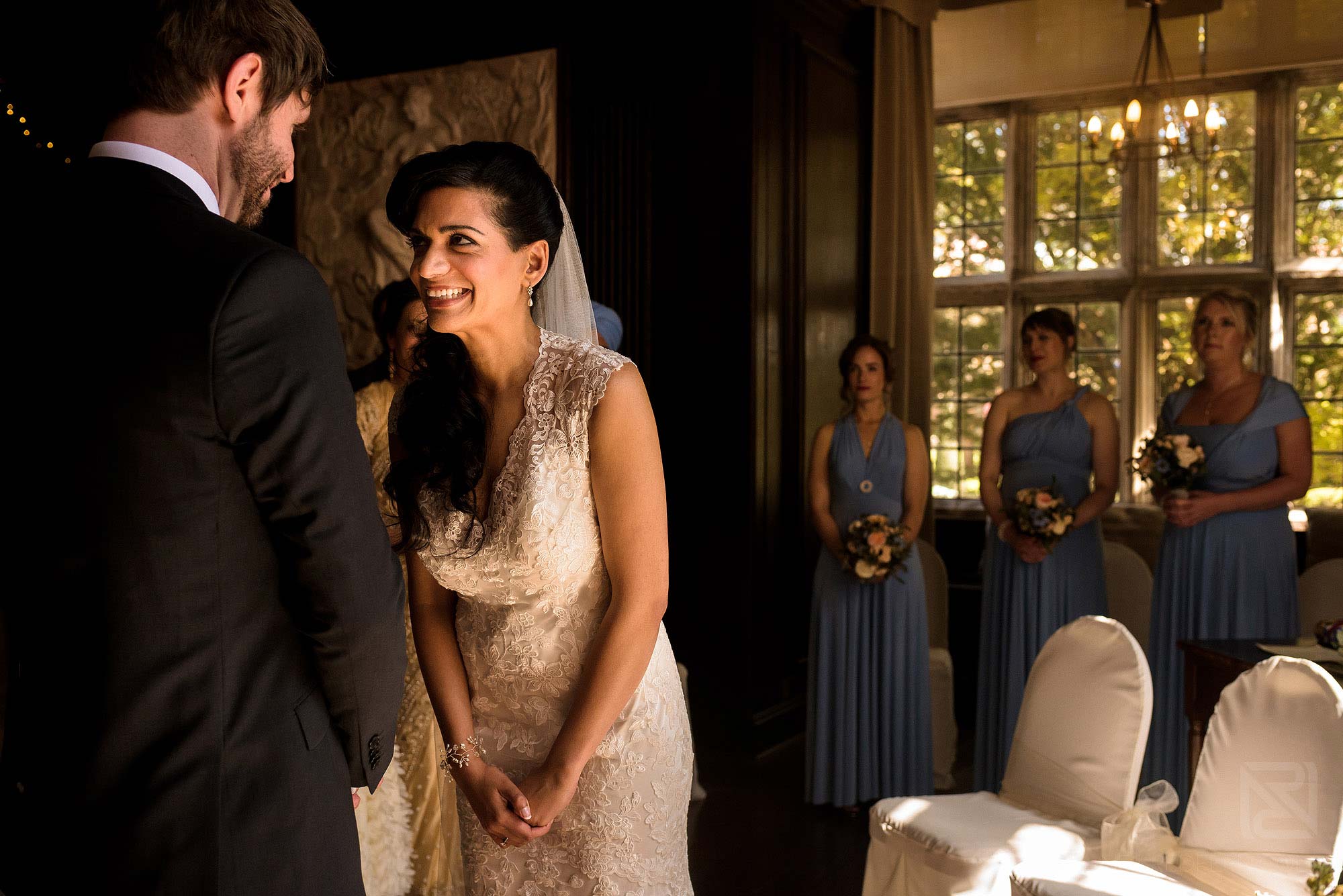 bride and groom laughing during wedding ceremony at Portmeirion in Wales