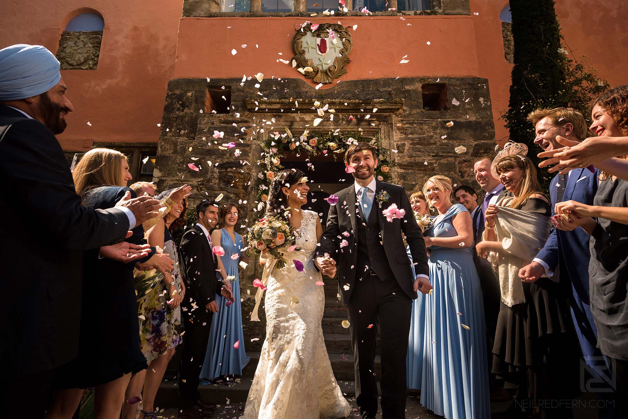 guests throwing confetti at wedding in Portmeirion