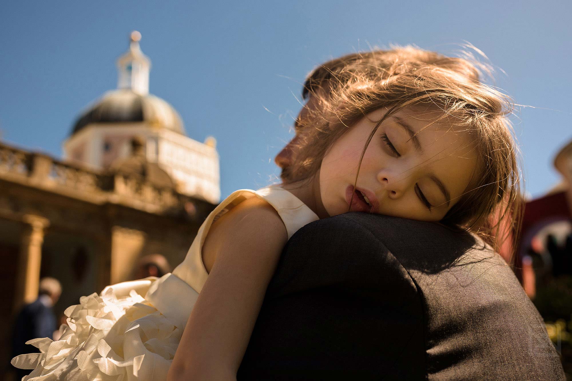 little girl sleeping during wedding