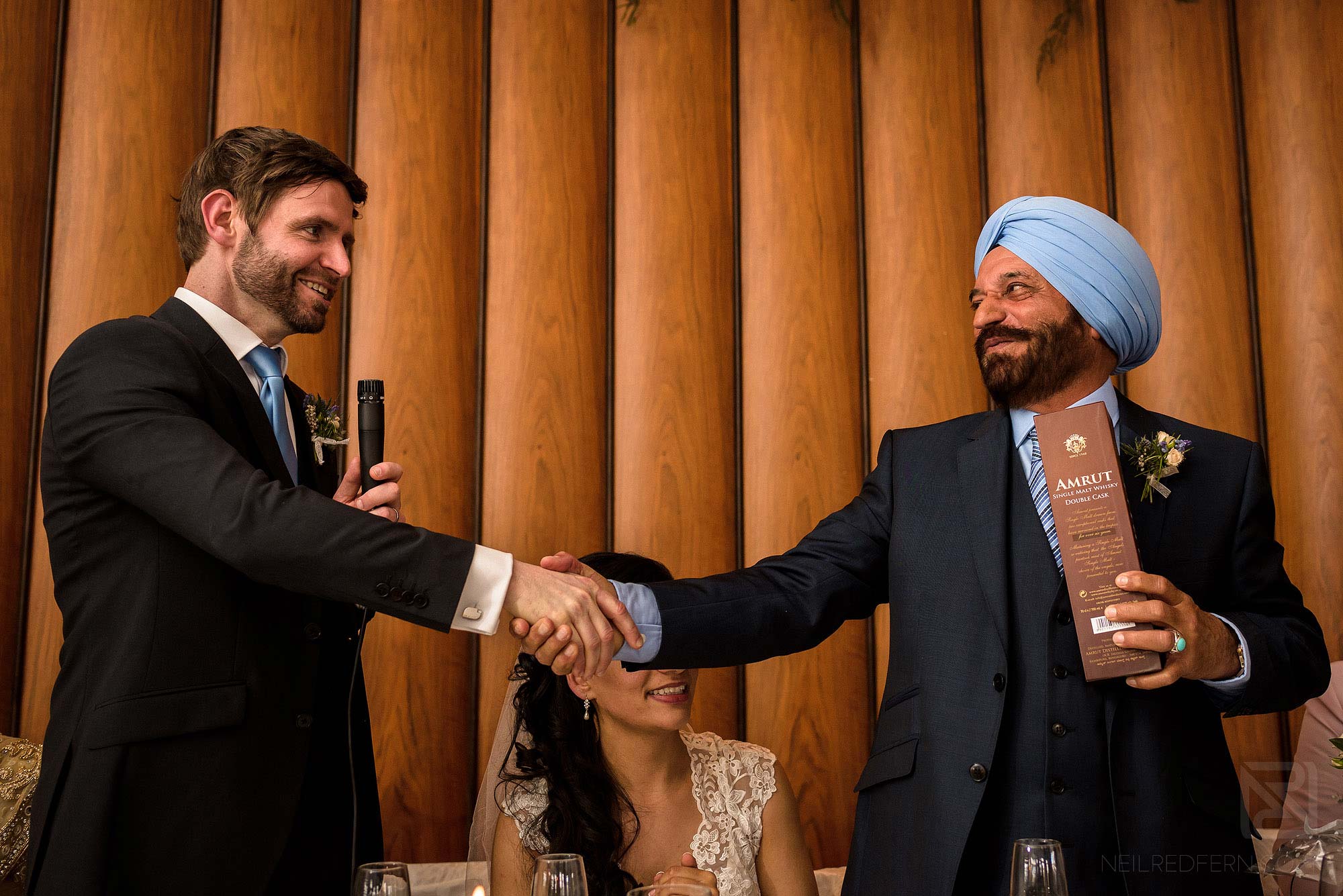groom and father of the bride shaking hands