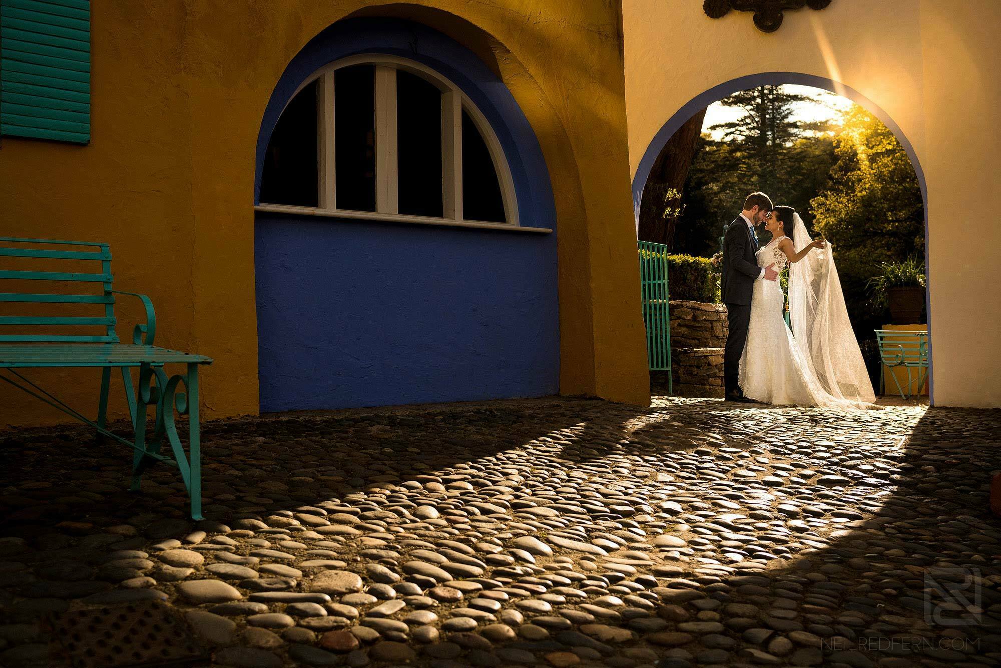 bride and groom photograph at sunset in Portmeirion