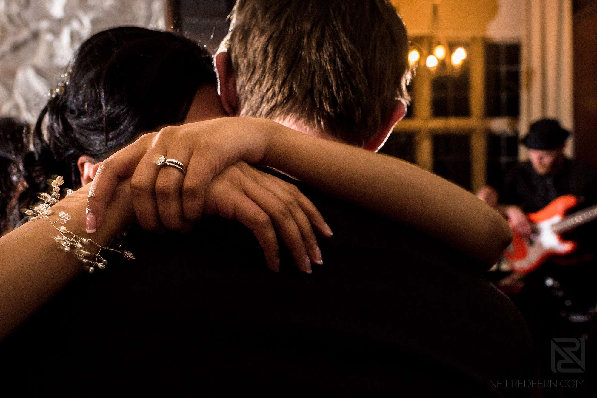 close up photograph of bride and groom dancing during wedding reception