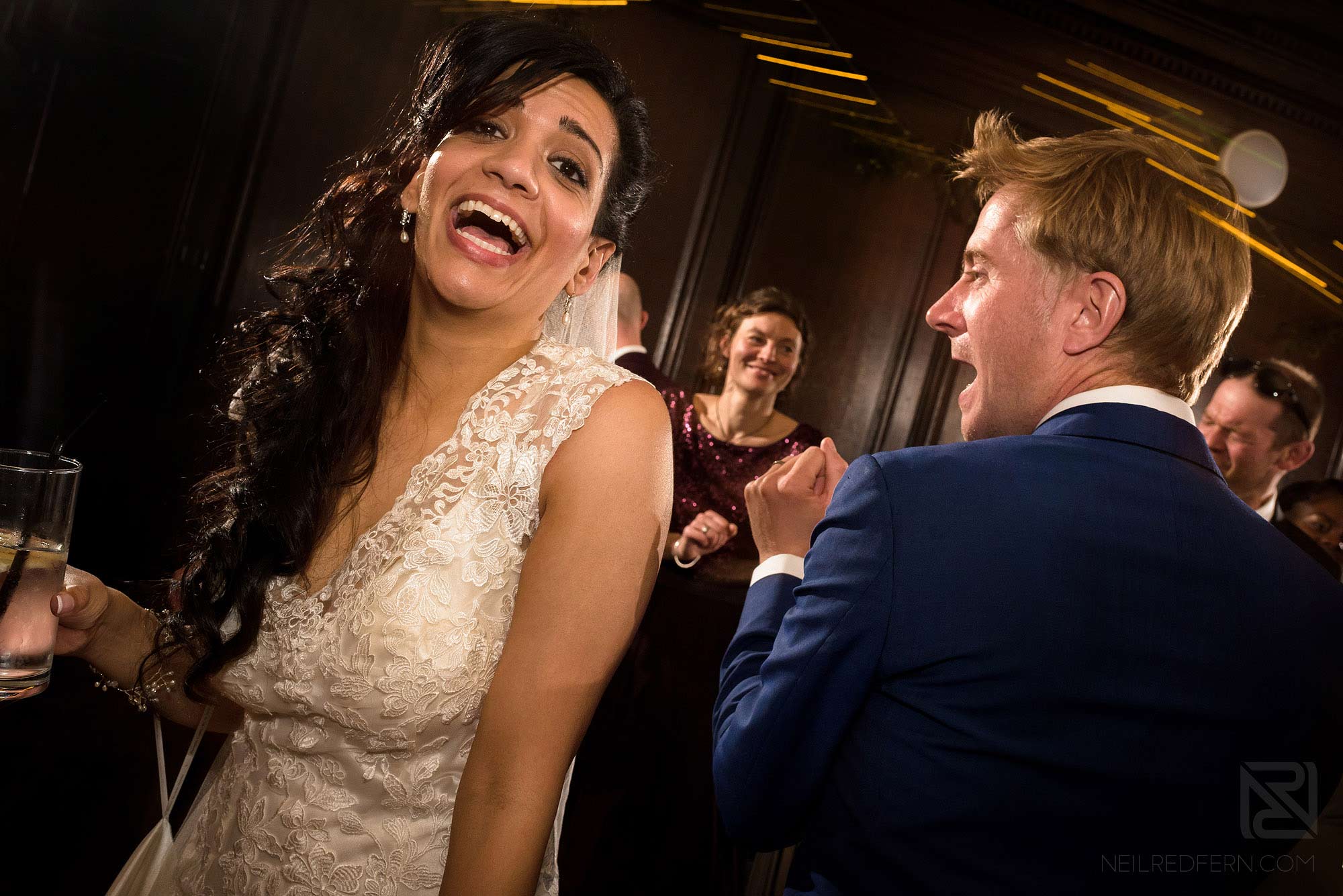 bride and guests dancing