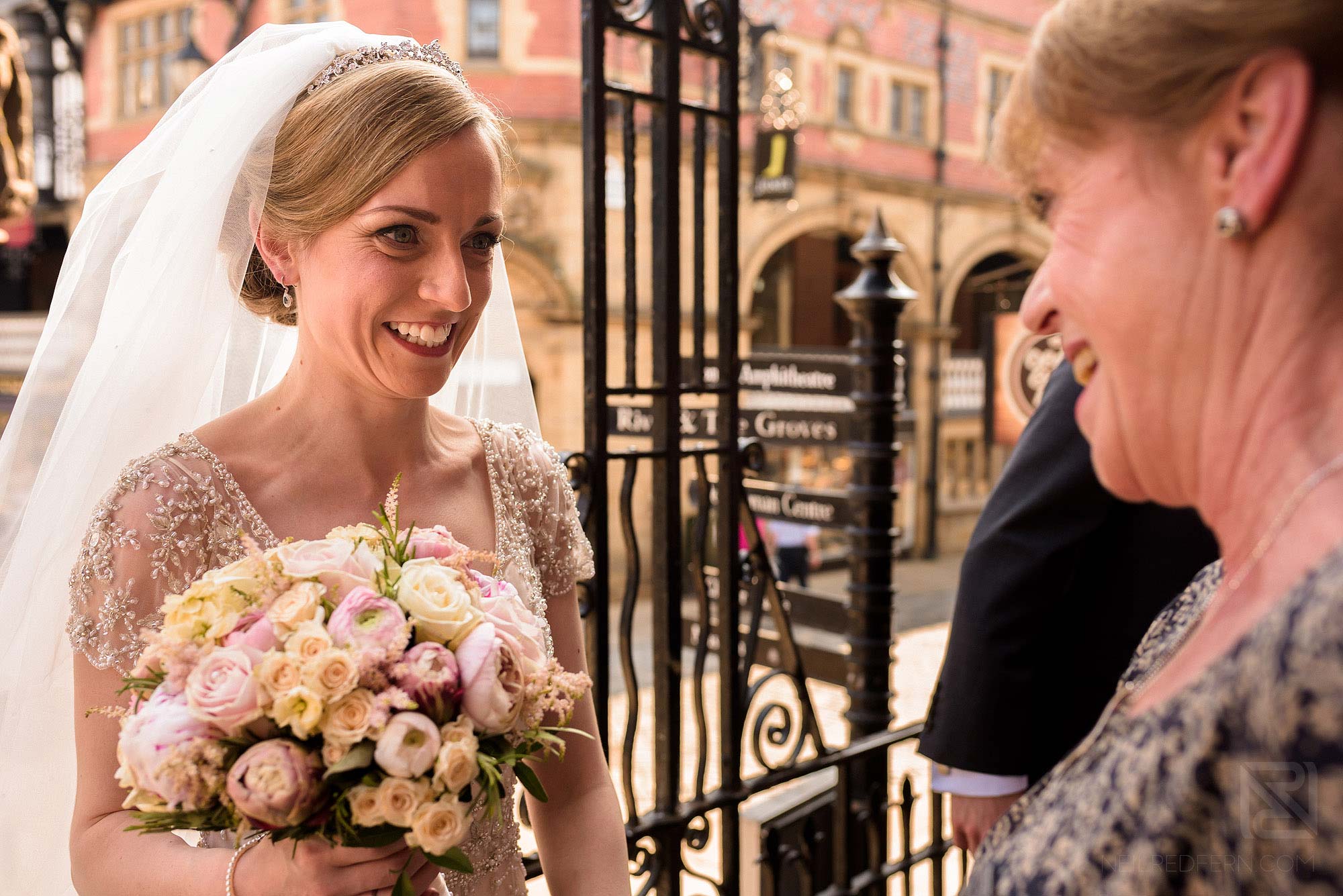 wedding guests congratulating bride