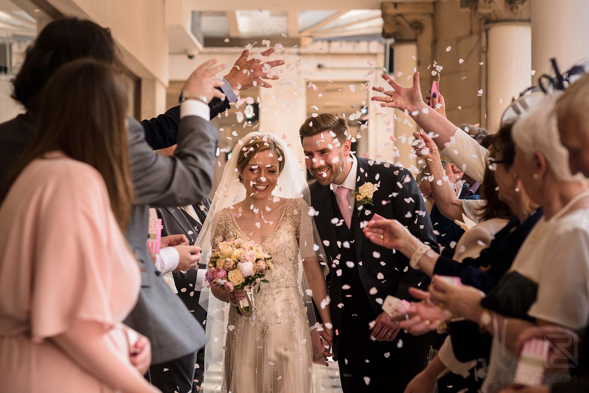wedding guests throwing confetti outside Chester Grosvenor Hotel