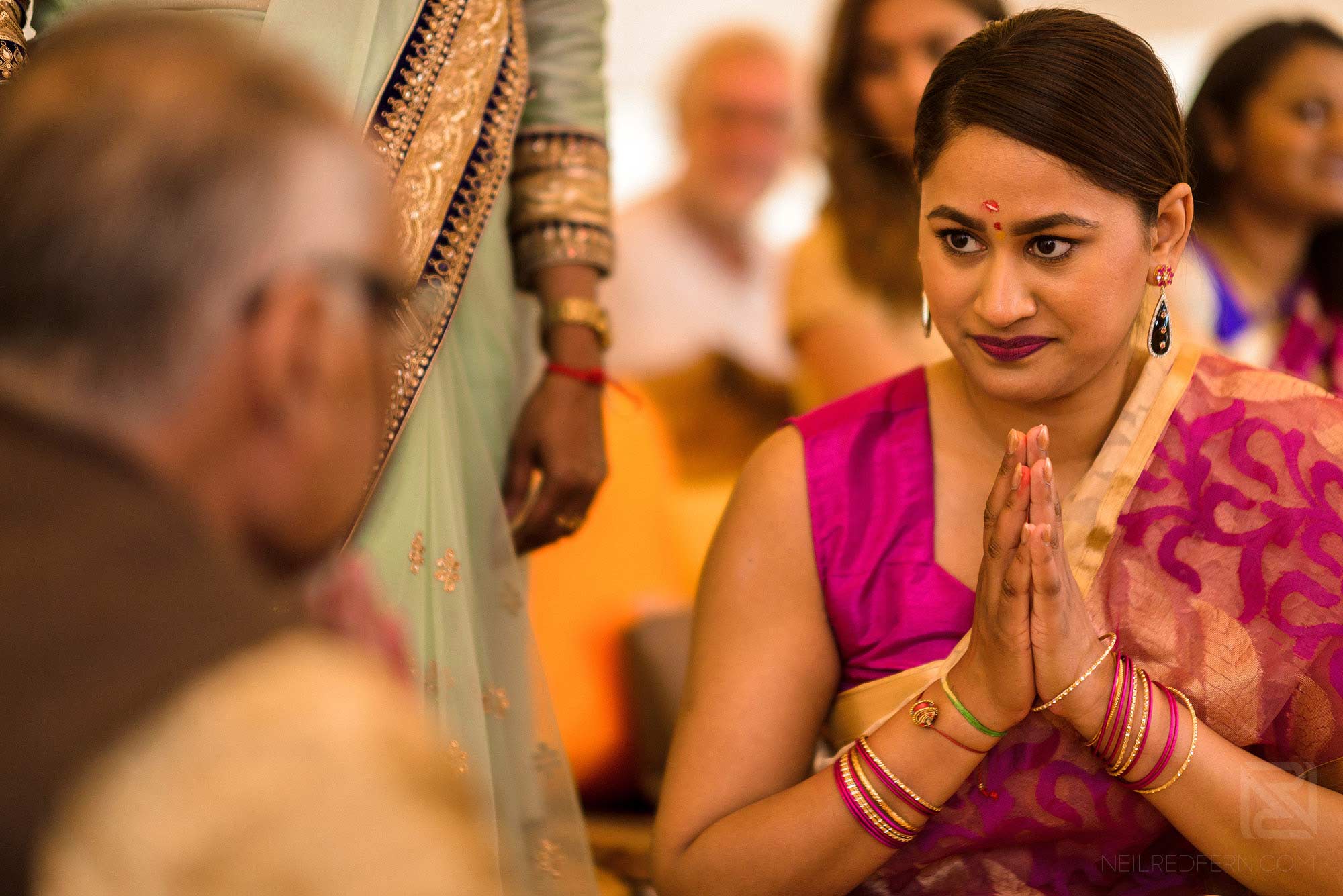 bride looking at priest during Haldi ceremony