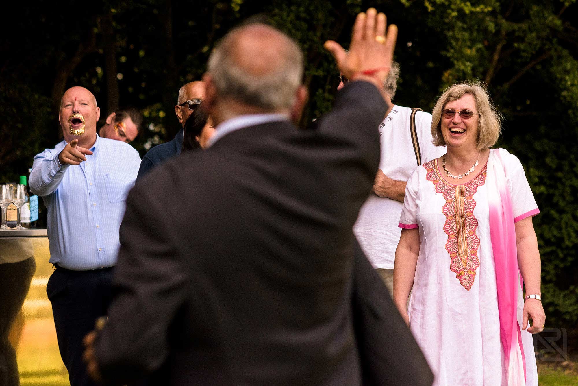 wedding guests laughing