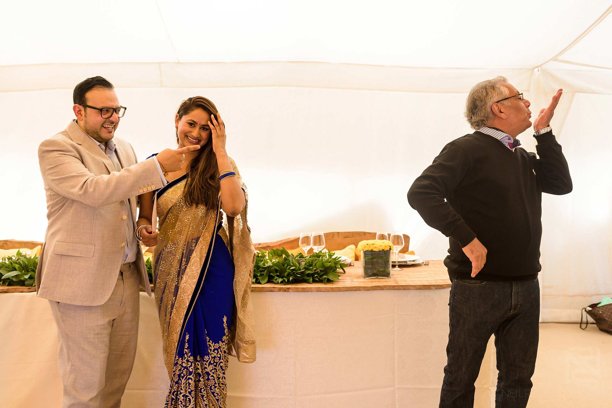 wedding guests laughing together