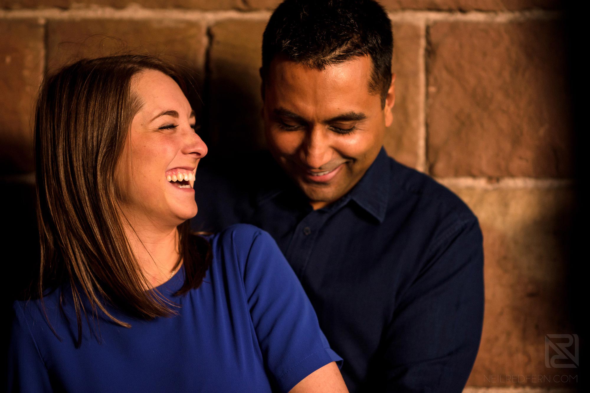 Manchester city centre engagement shoot 1 couple laughing on engagement shoot
