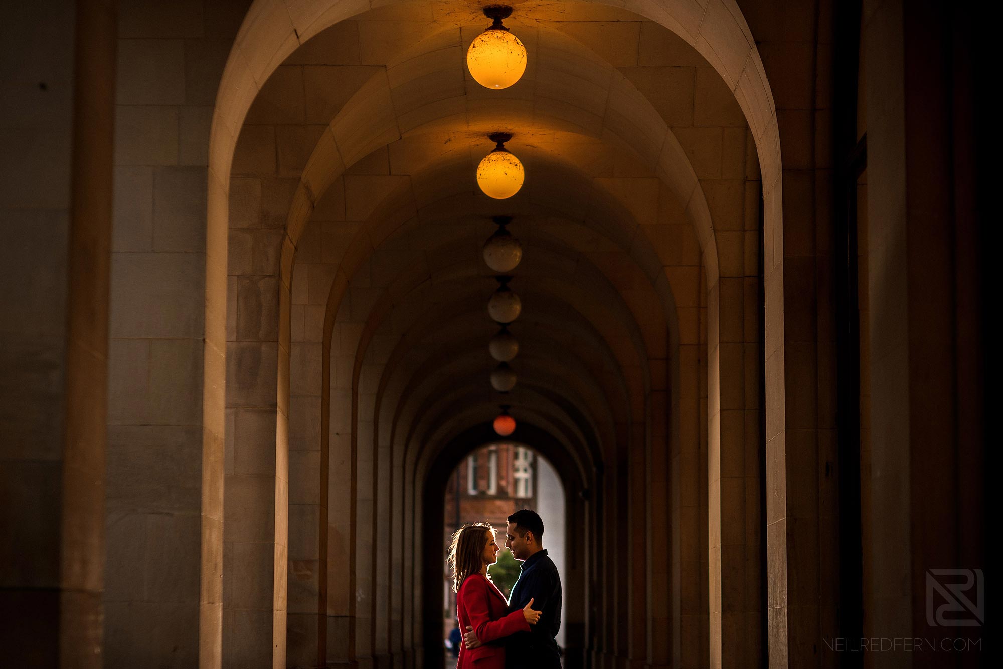 Manchester city centre engagement shoot 12 couple underneath arches in St Peter's Square in Manchester