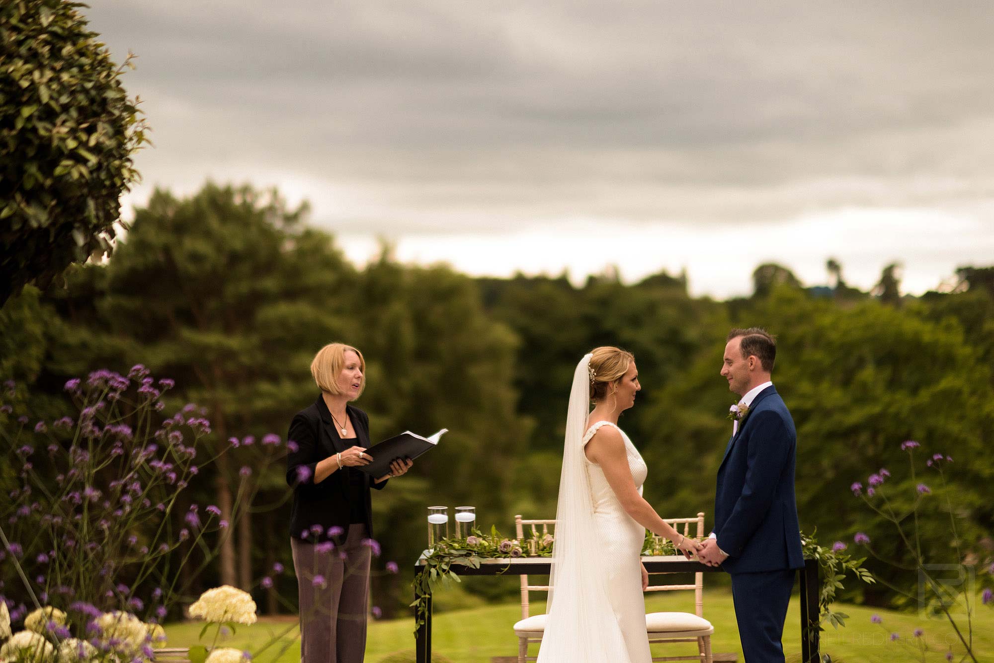 bride and groom saying vows at Delamere Manor