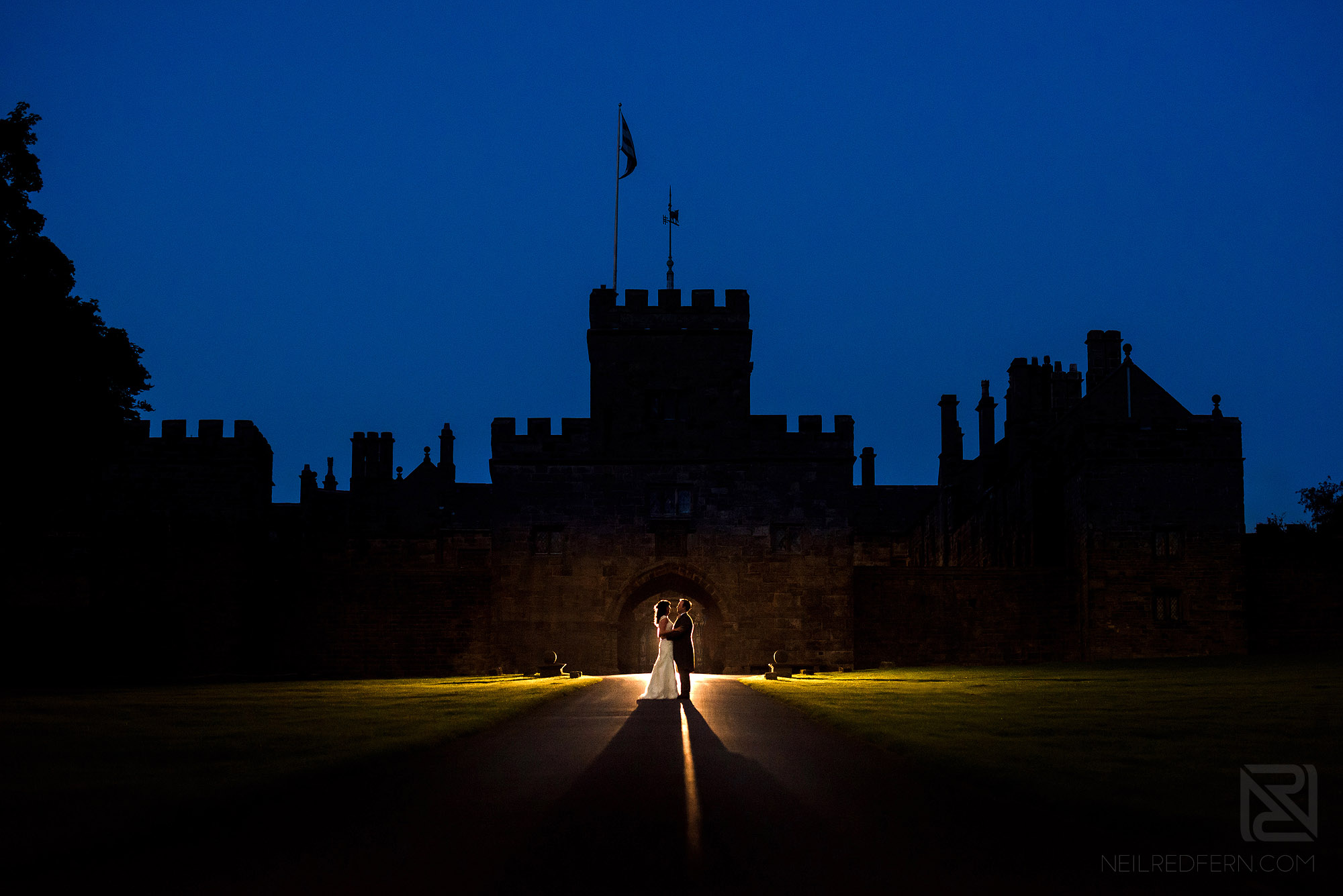creative photograph of bride and groom outside Hoghton Tower in Lancashire
