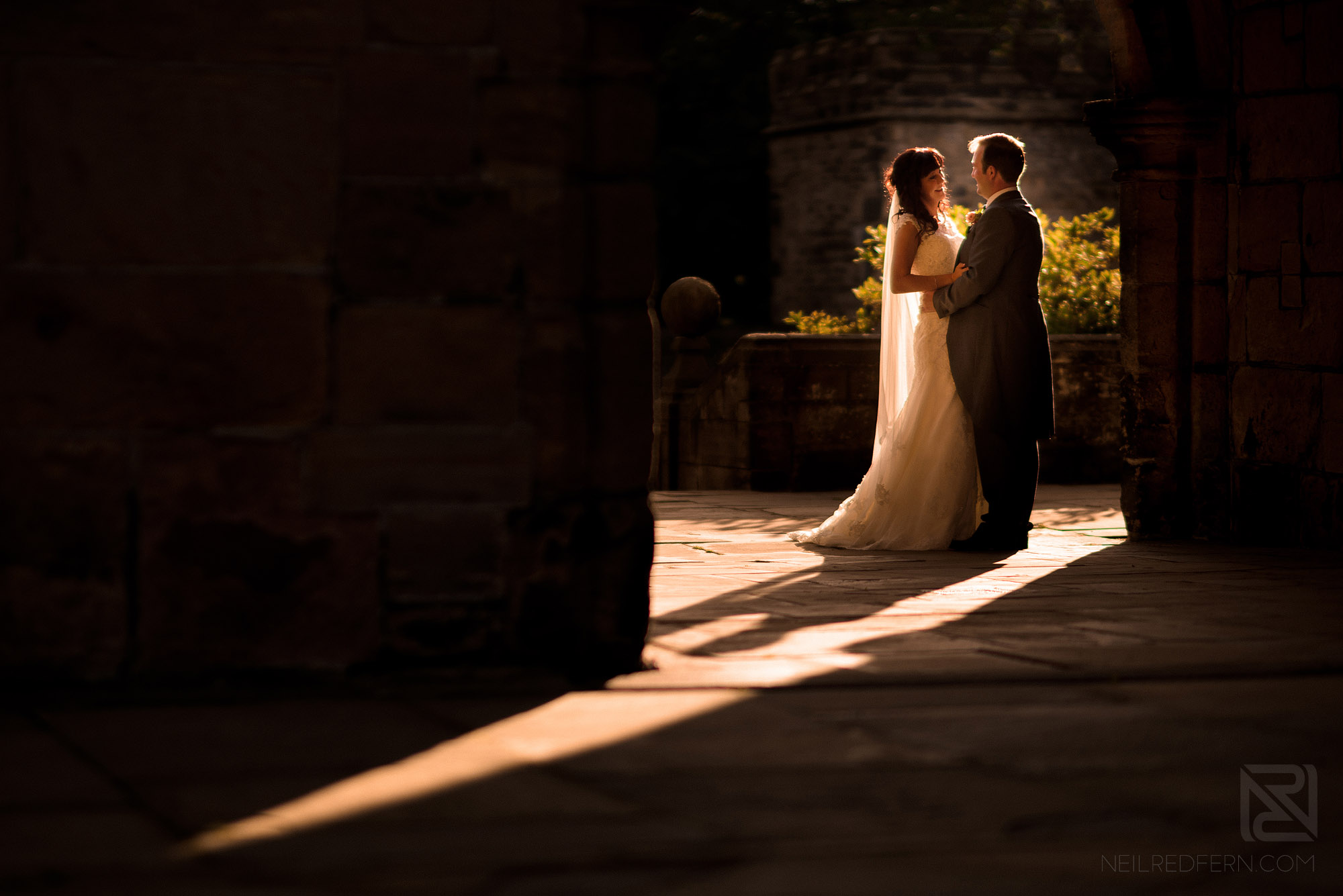 portrait of bride and groom at sunset at Hoghton Tower