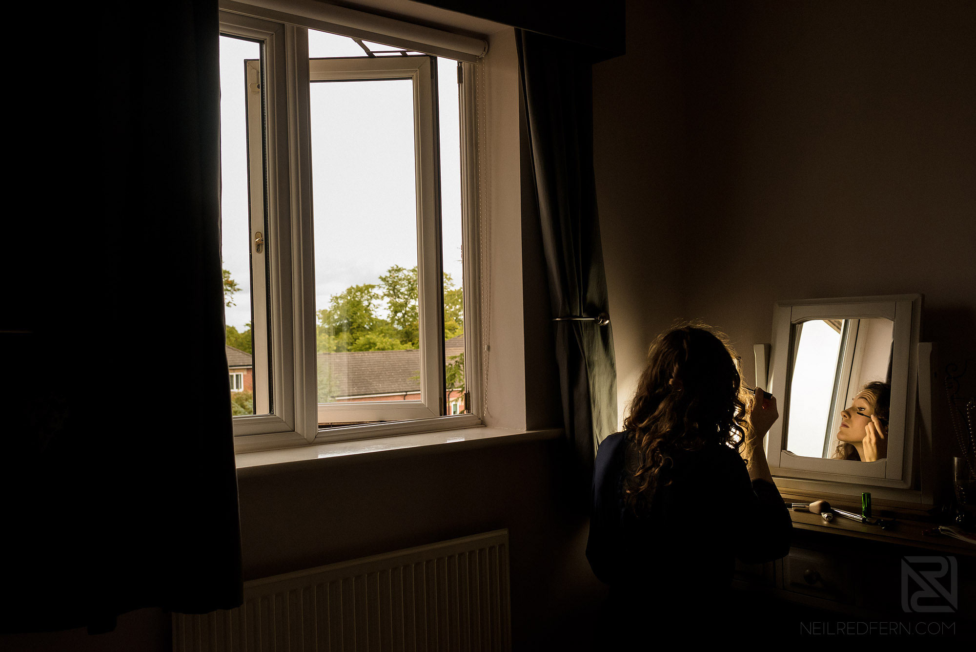 bride getting ready at home on morning of wedding