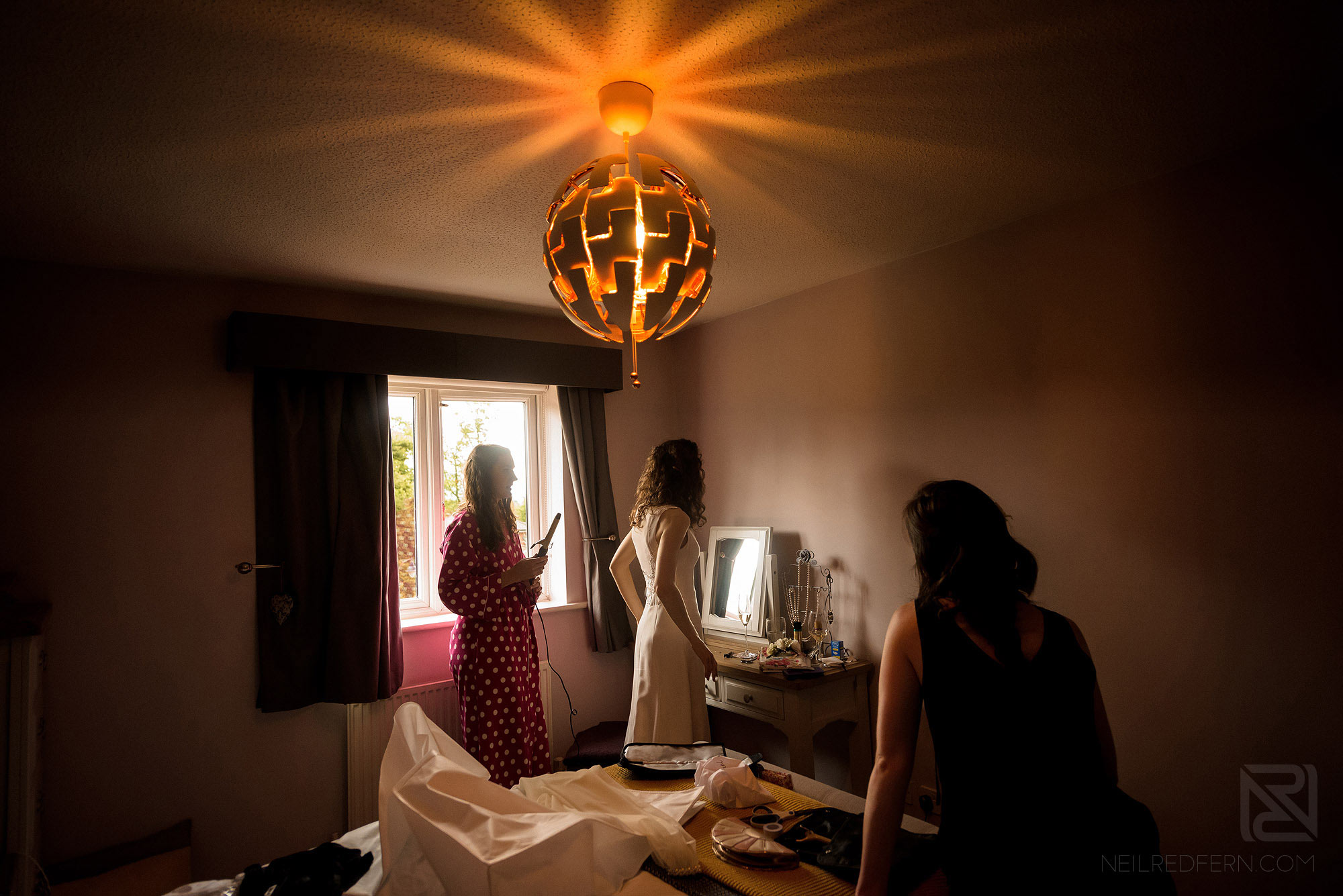 bride and and bridesmaids getting ready at home