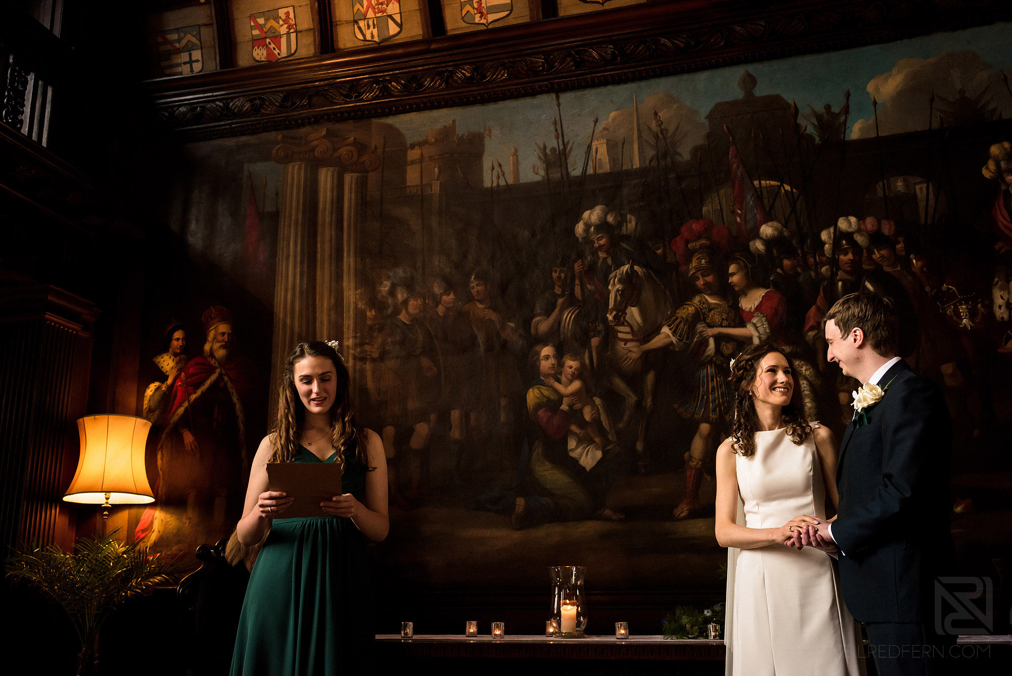 bridesmaid doing a reading during wedding ceremony