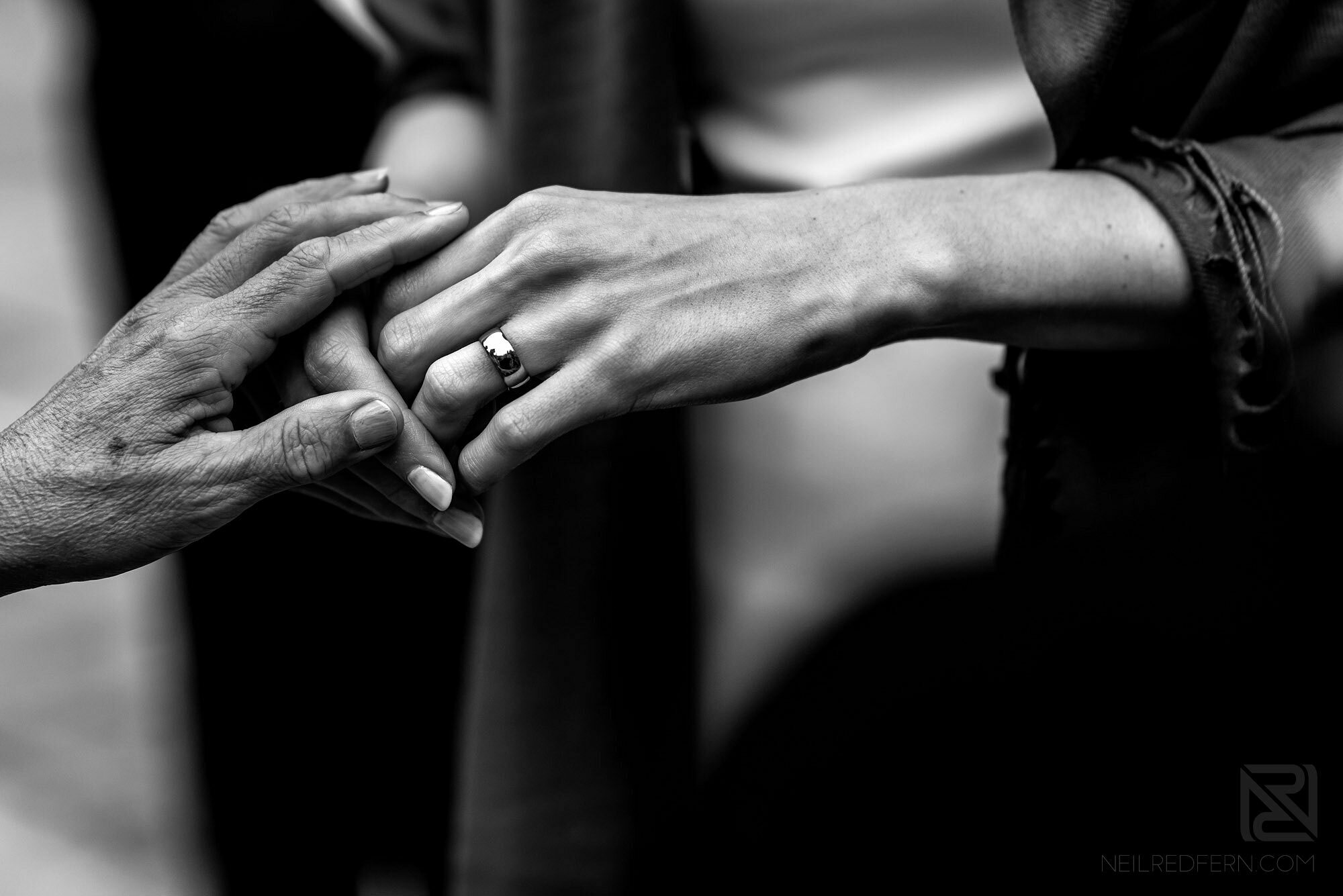bride showing wedding ring to grandma